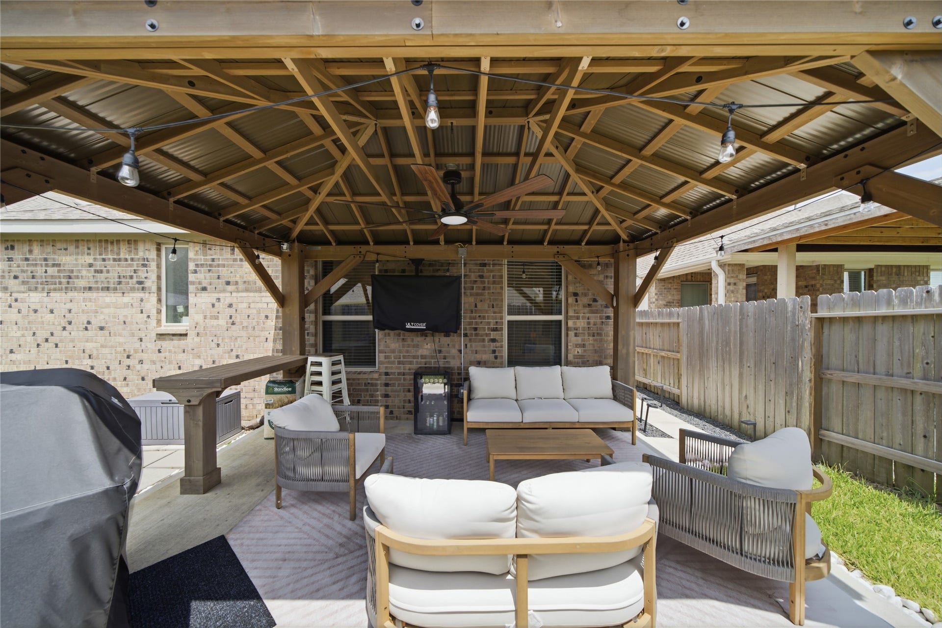 4919 Sand Clouds Drive, Katy, TX 77493 Easy access from the back door to enjoy the outdoors while having shade and cover.
