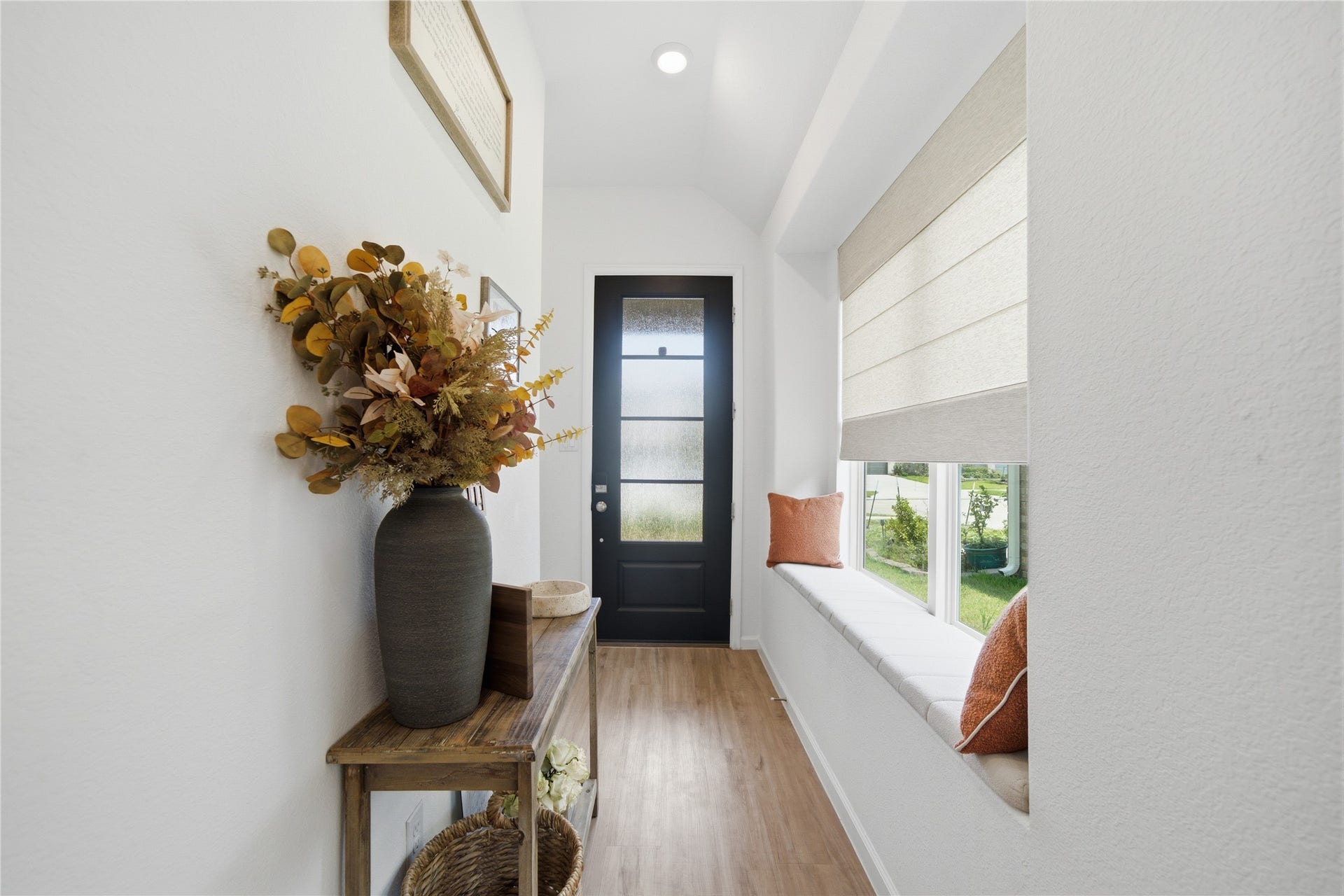 4919 Sand Clouds Drive, Katy, TX 77493 Theentryway features a sleek black door, elegant light toned flooring, and a large window allowing the light to filter in