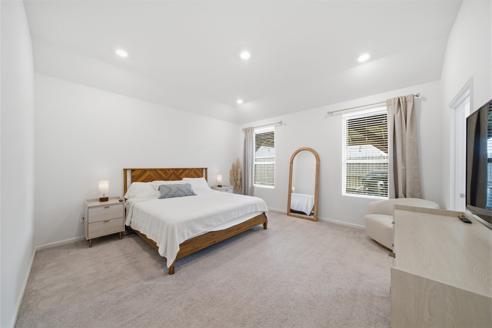 4919 Sand Clouds Drive, Katy, TX 77493 The primary bedroom is spacious with two windows and recessed lighting