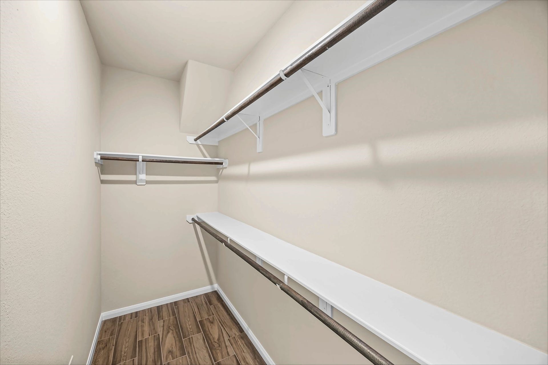 Keep your favorites organized and within reach in this walk-in closet with shelving and hanging space.