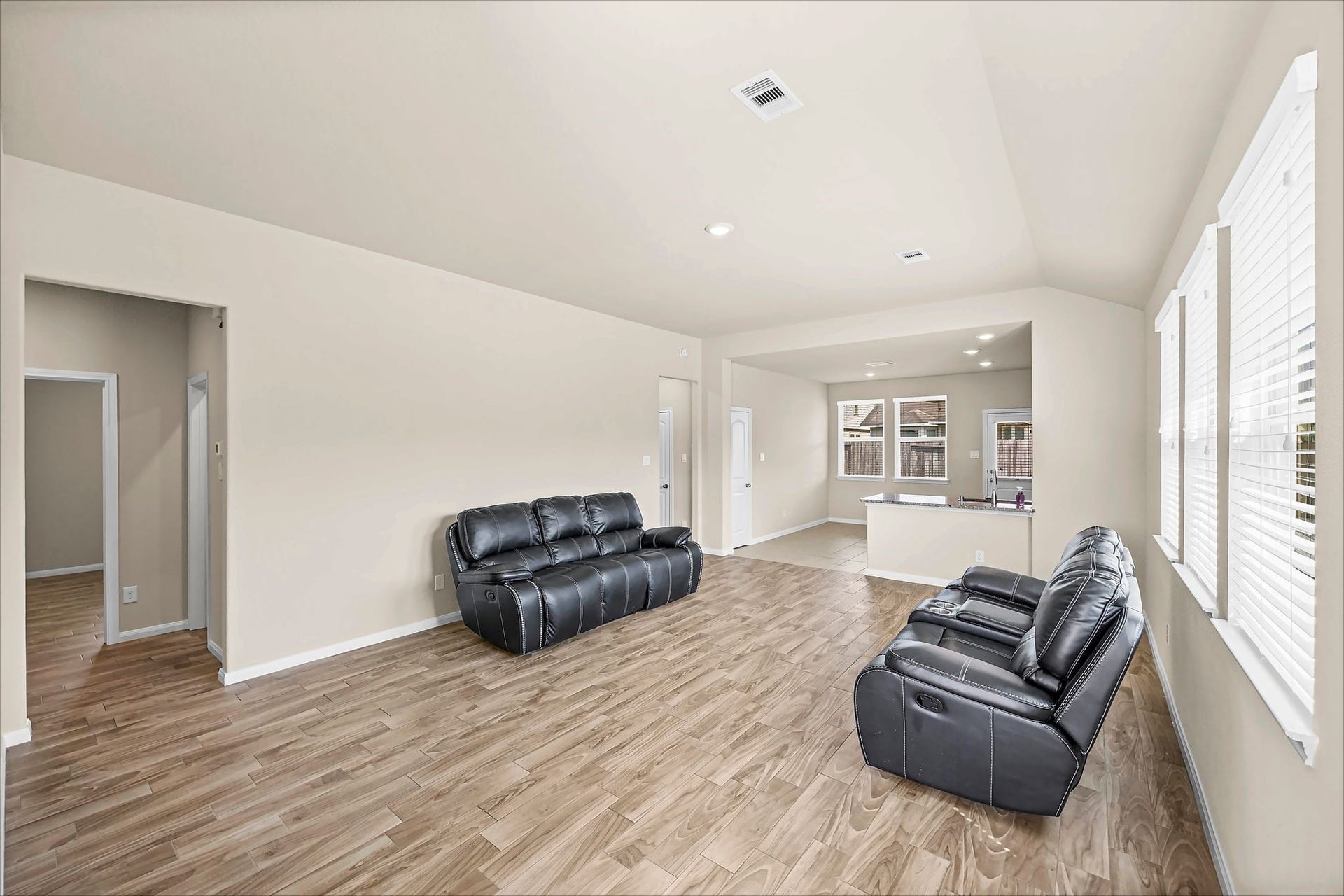 Gather, relax, and feel at home in this open living area with tile flooring throughout.