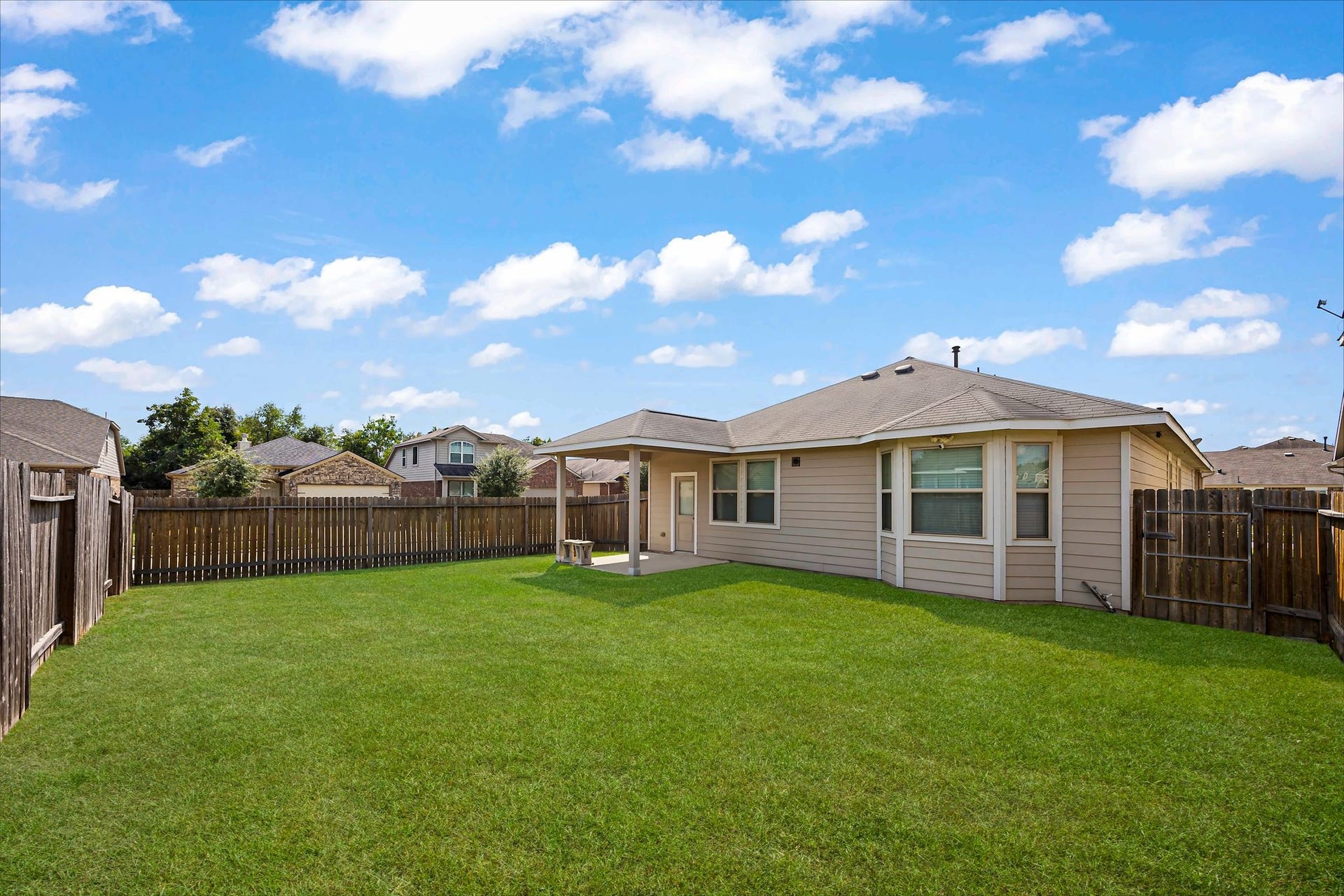 Make the backyard your happy place, with room for outdoor seating, play, or simply unwinding at home.