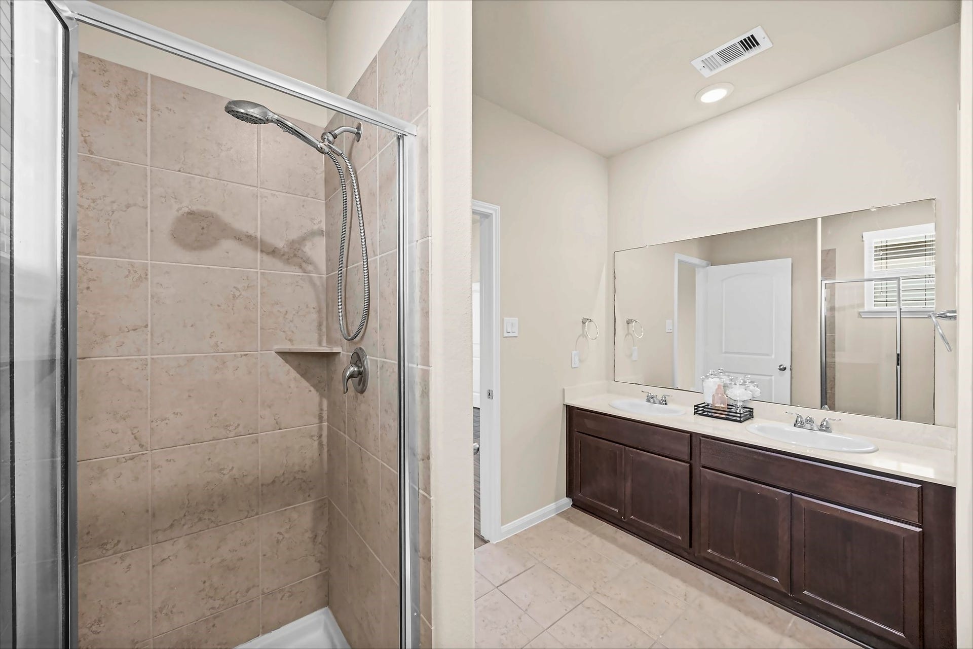 Start and end the day comfortably with a double-sink vanity and separate shower in the primary bath.