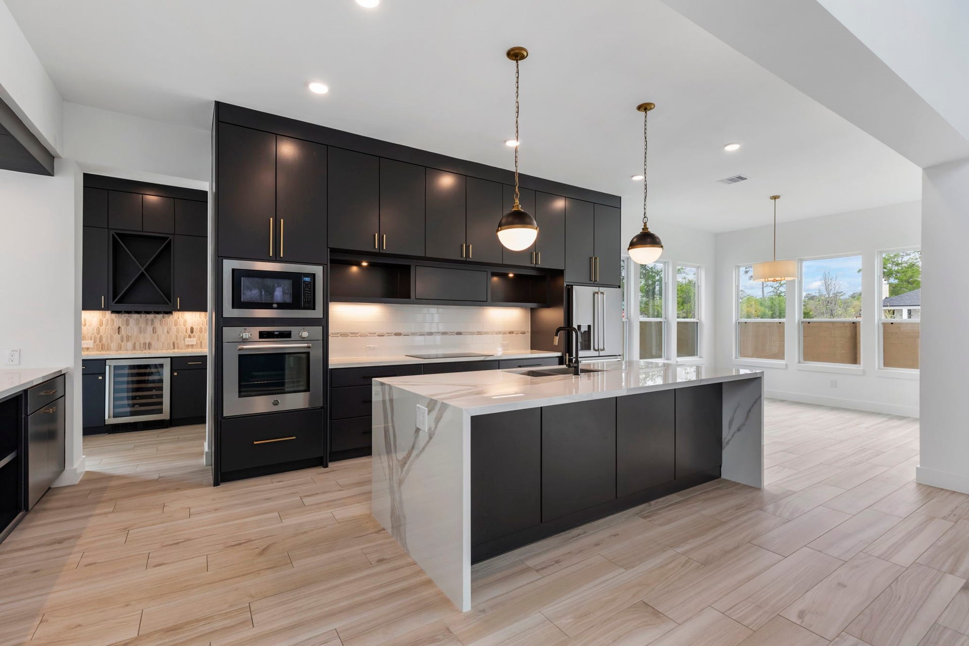 24739 Trull Brook Lane, Spring, TX 77389 Sleek kitchen with breakfast bar.
