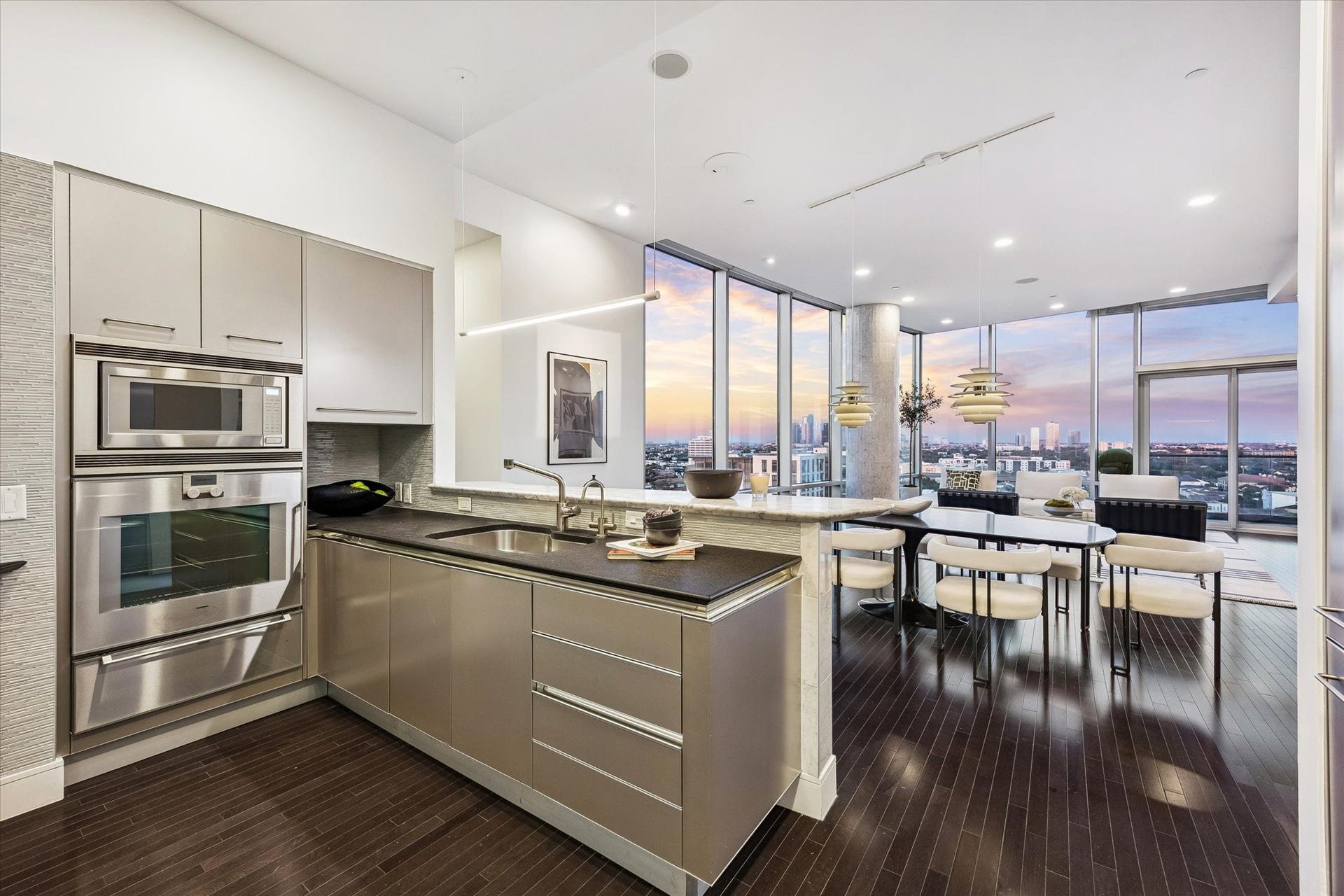 2727 Kirby Drive, #13E, Houston, TX 77098 Fabulous kitchen with bar seating, Gaggenau and Sub-Zero appliances including built-in refrigerator/freezer and gas cooktop.