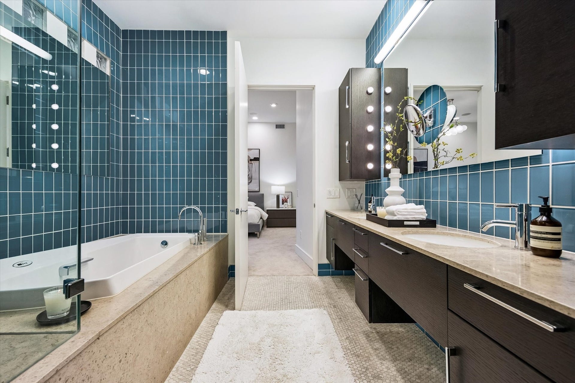 [Primary Bathroom] Primary bathroom with double sinks, custom closet, walk-in shower with bench and separate tub.