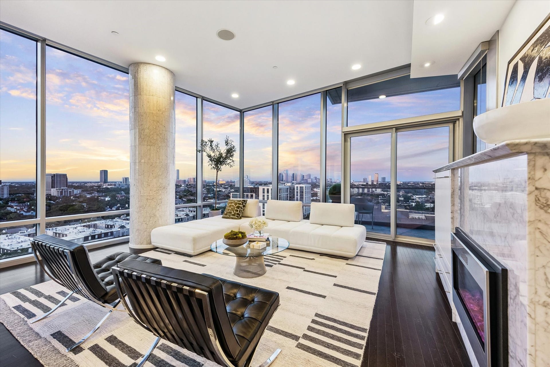 2727 Kirby Drive, #13E, Houston, TX 77098 Living room with incredible floor to ceilings views to the north and east, built-in speakers and access to one of two private balconies.
