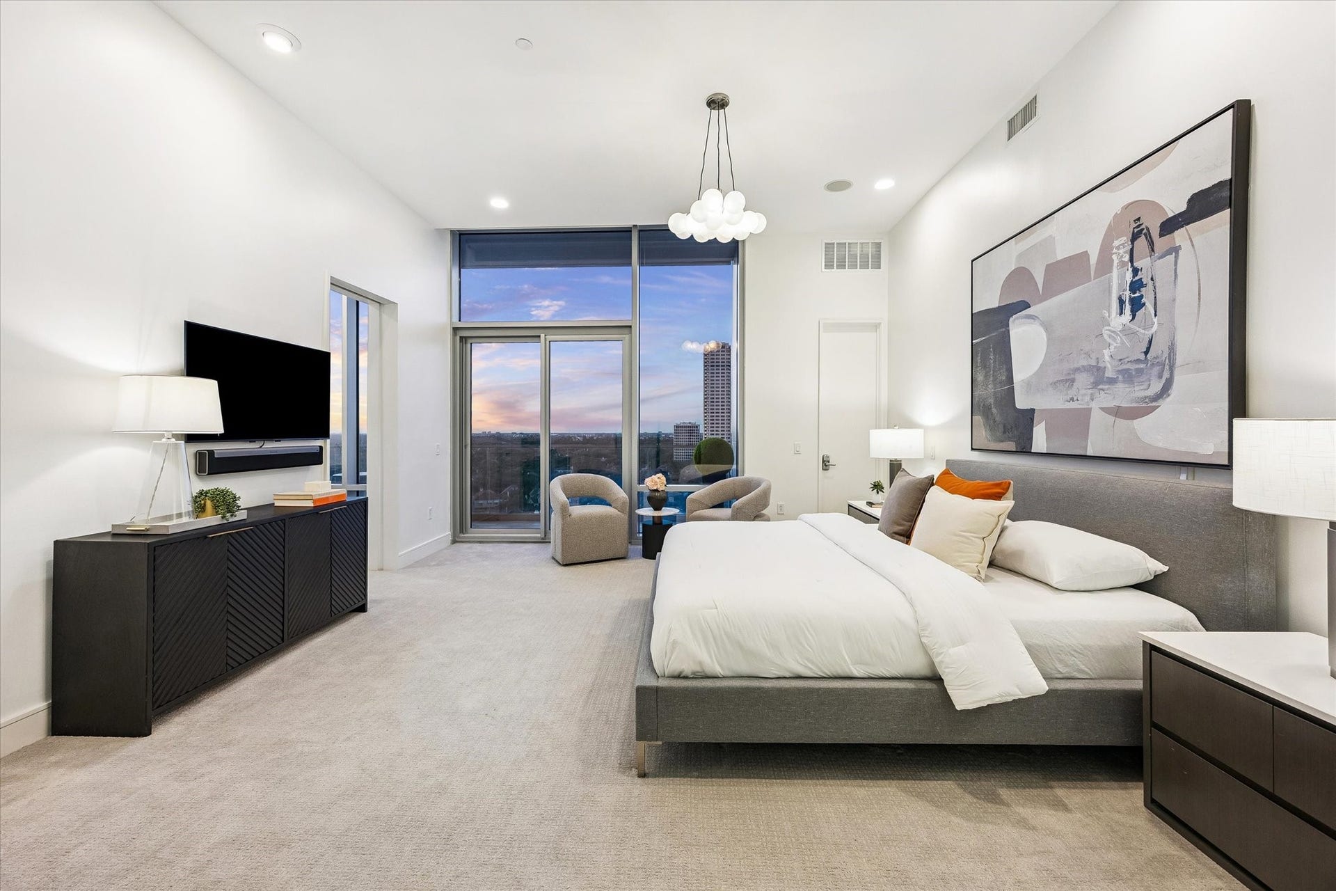 [Primary Bedroom] The secluded primary bedroom features 2026 carpet, floor-to-ceiling windows, en-suite bath, private office and balcony.