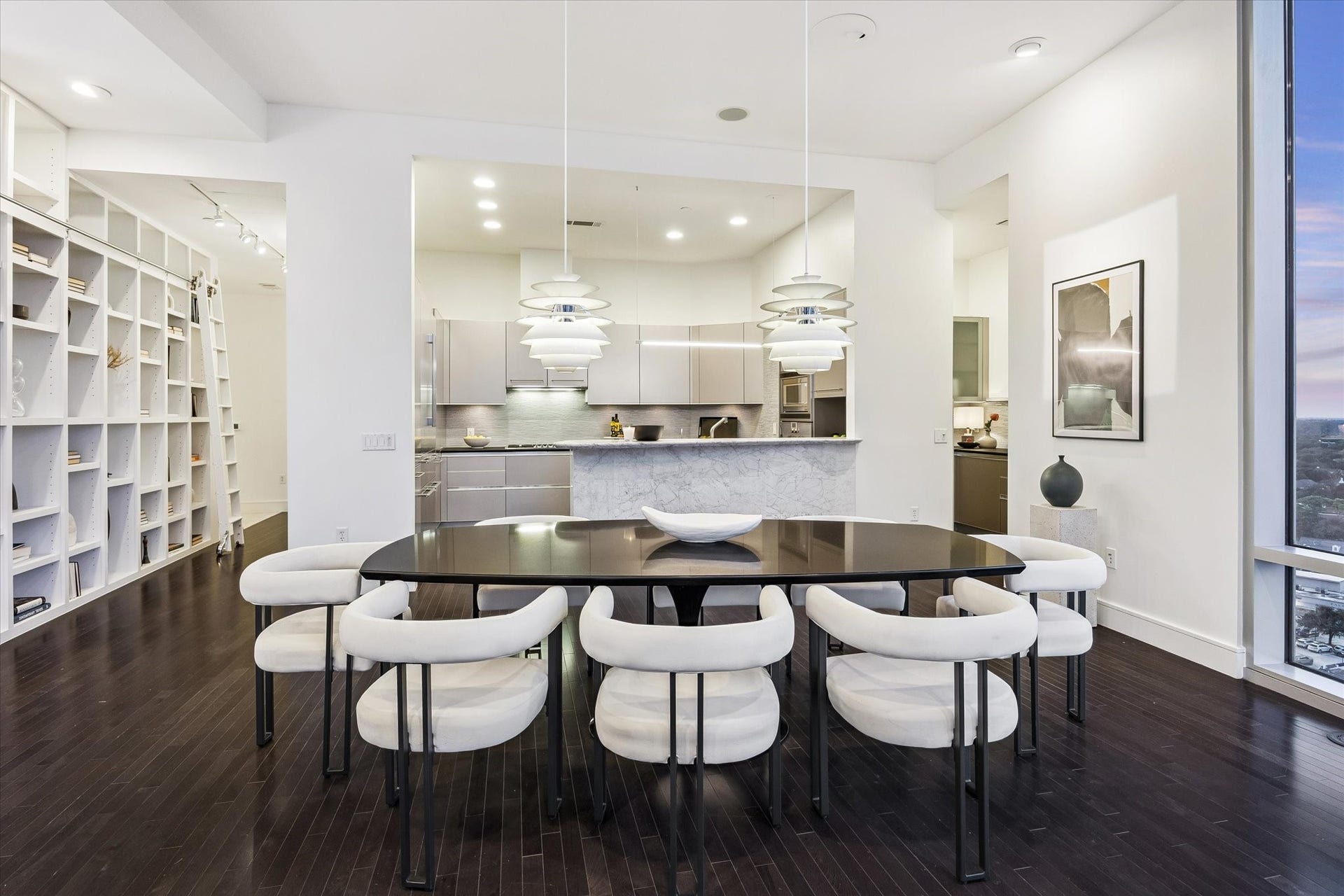 2727 Kirby Drive, #13E, Houston, TX 77098 Dining area with statement pendant lighting with panoramic city views. Seamless access to the bar area.