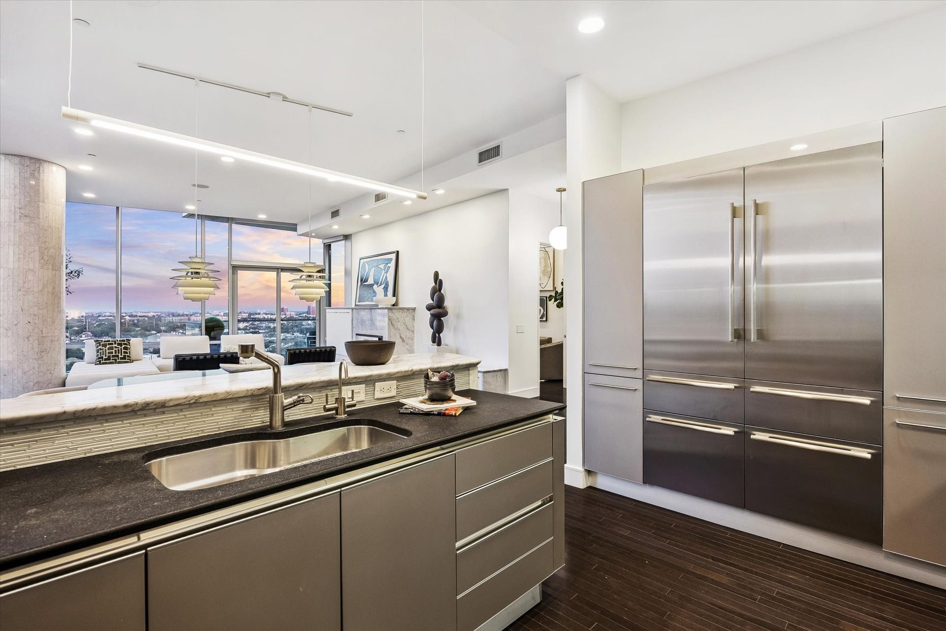 2727 Kirby Drive, #13E, Houston, TX 77098 Kitchen feautes updated appliances and lighting, including a 2026 SubZero fridge.