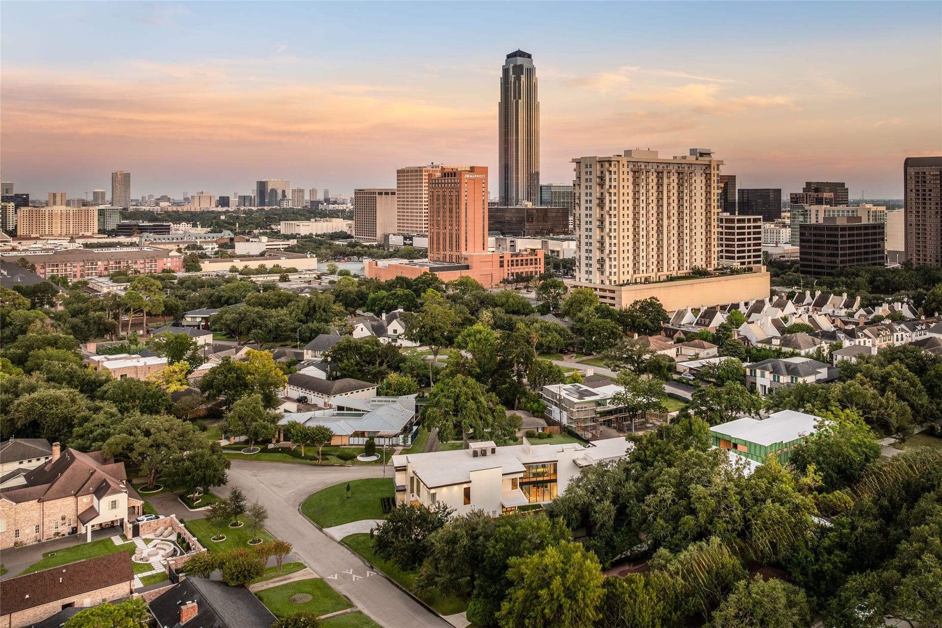 Elevated living with breathtaking skyline views., surrounded by prestigeous estates, mature trees and the timeless beauty of an established neighborhood