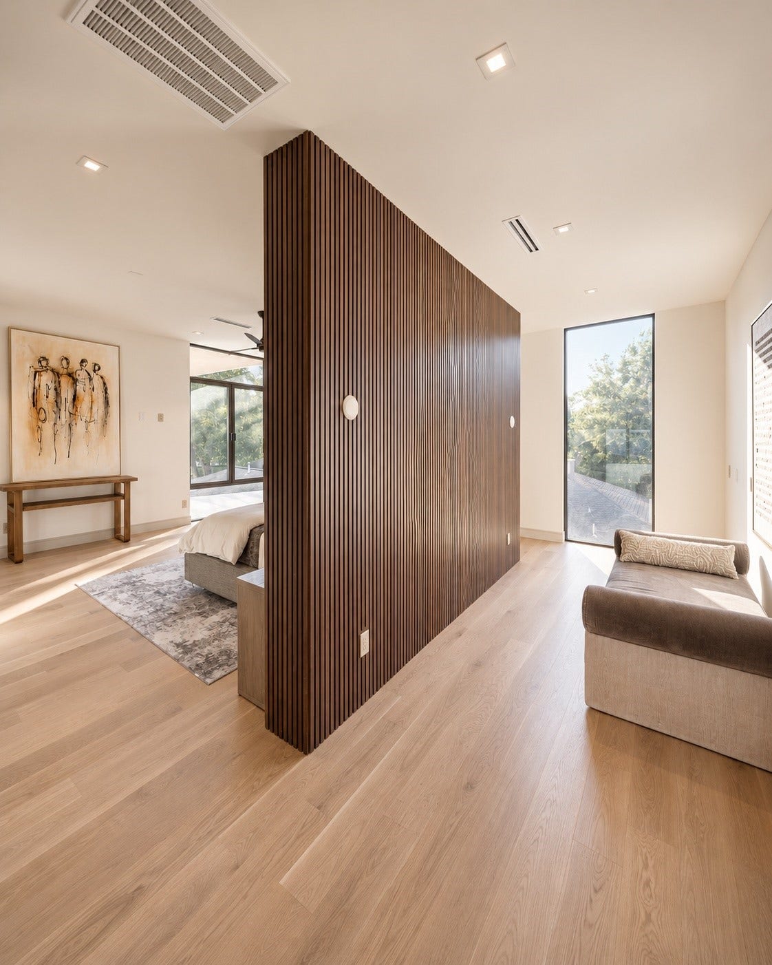 The second-floor primary suite makes a striking statement with its dramatic wall of rich vertical wood detailing, beautifully defining the bedroom while creating an unexpected bonus area beyond. Perfect for quiet reading, nursery , private lounge or personalized bonus room.