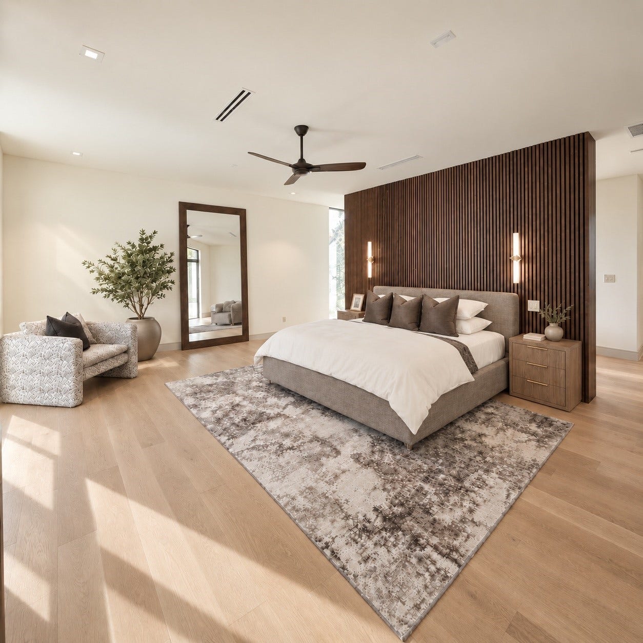 The second floor primary suite is less a bedroom and more a private sanctuary suspended above the rest of the home. A striking wall of vertical wood slats creates a dramatic backdrop. With space to lounge, unwind and completely retreat from the worked below, this is where modern design meets the quiet luxury of having an entire escape all to yourself.