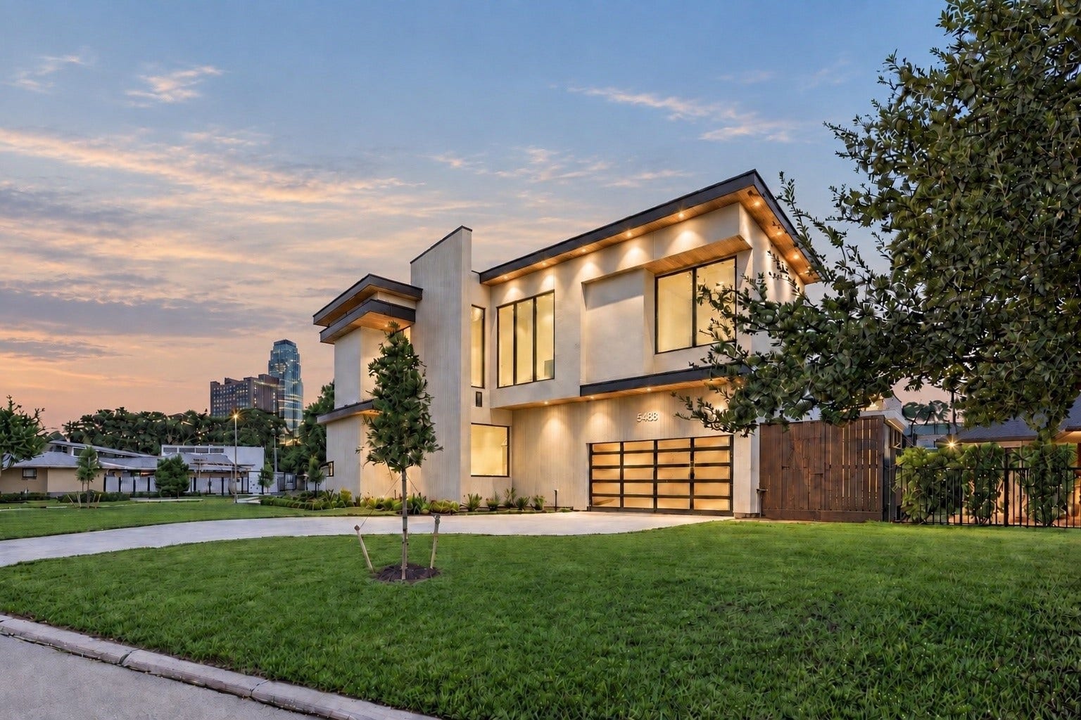 A striking modern residernce where bold architecture, warm illumination and dramatic sunset!
