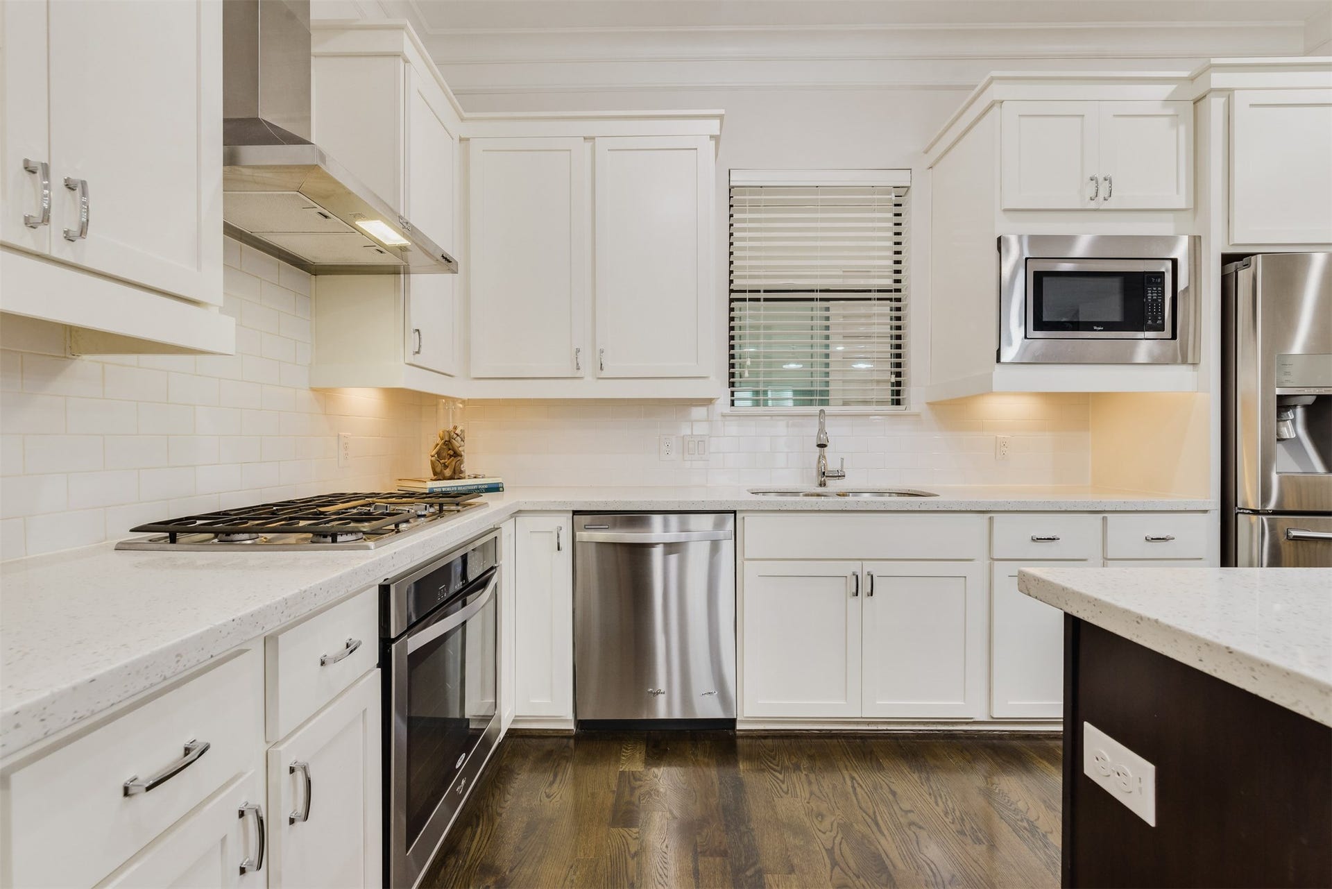 Modern kitchen with quartz countertops and top of the line stainless steel appliances
