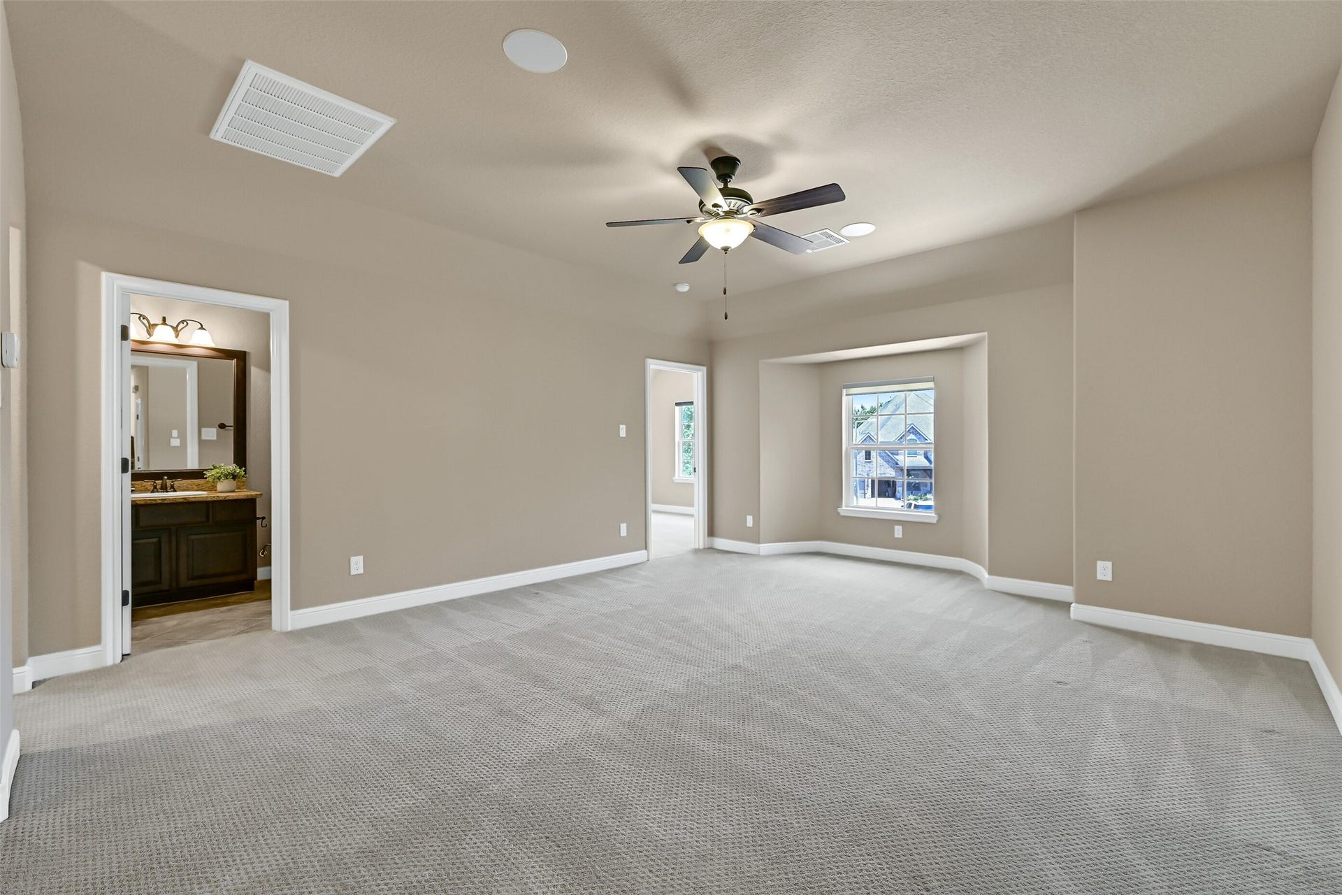 2304 Halls Creek Court, Friendswood, TX 77546 Upstairs, the oversized game room offers endless flexibility for play time, gaming tables, a pool table, or a second living area, all with plush sculpted carpet, built-in speakers, and plenty of room to spread out. A full bathroom is also accessible from this space.