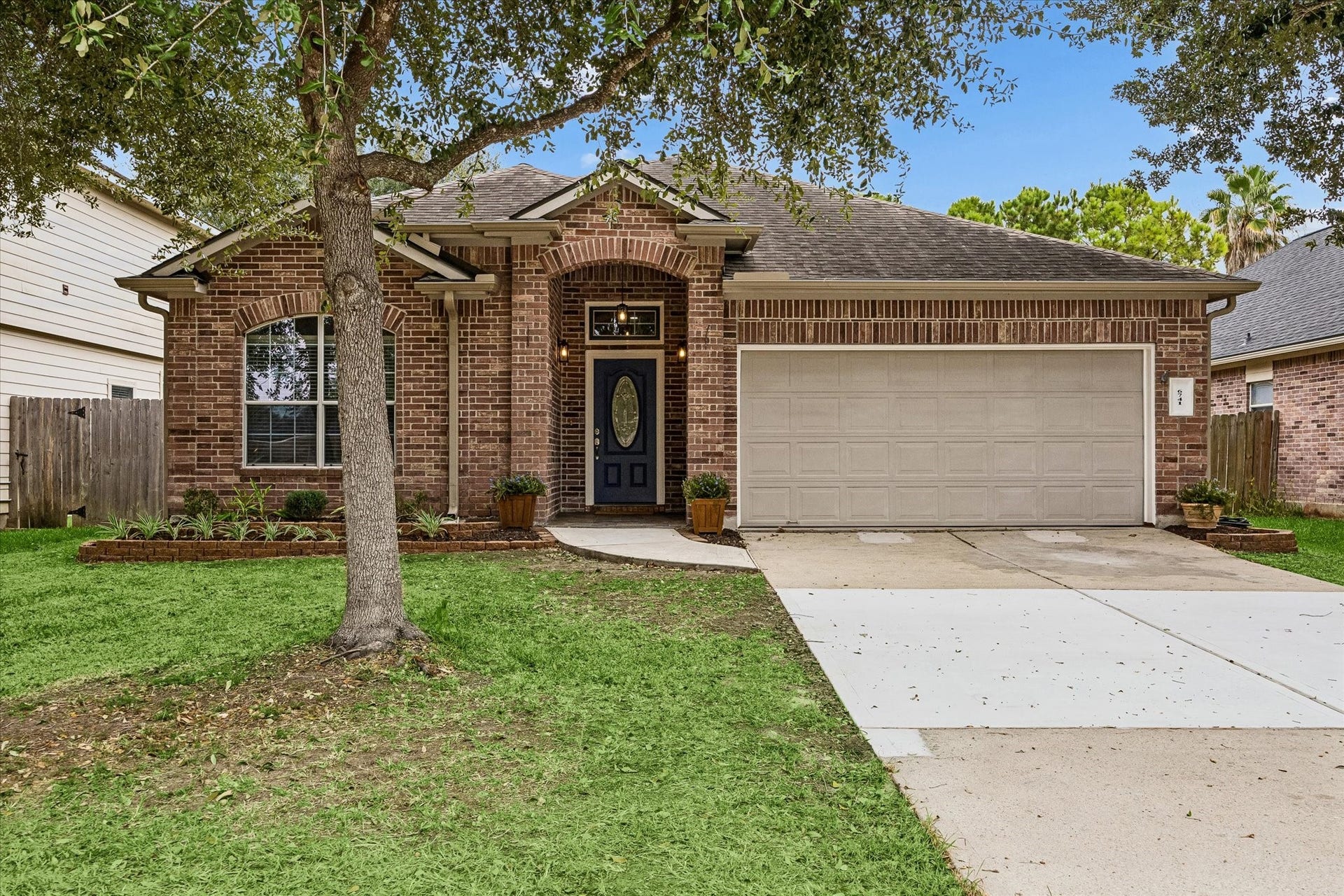 6741 Hidden Colony Lane, Dickinson, TX 77539 Experience the charm of this home with its newly landscaped exterior and inviting slate stone entryway, perfect for creating a warm welcome.