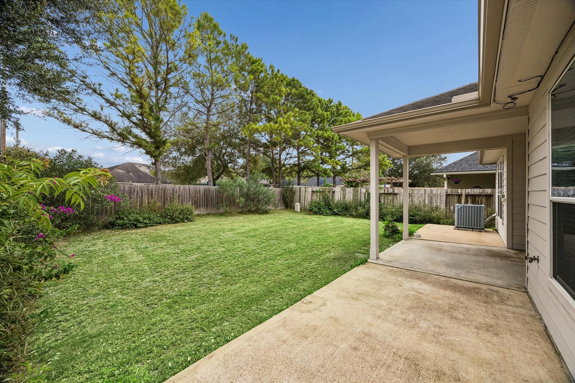 6741 Hidden Colony Lane, Dickinson, TX 77539 Enjoy seamless entertaining in the spacious backyard featuring an inviting extended patio.