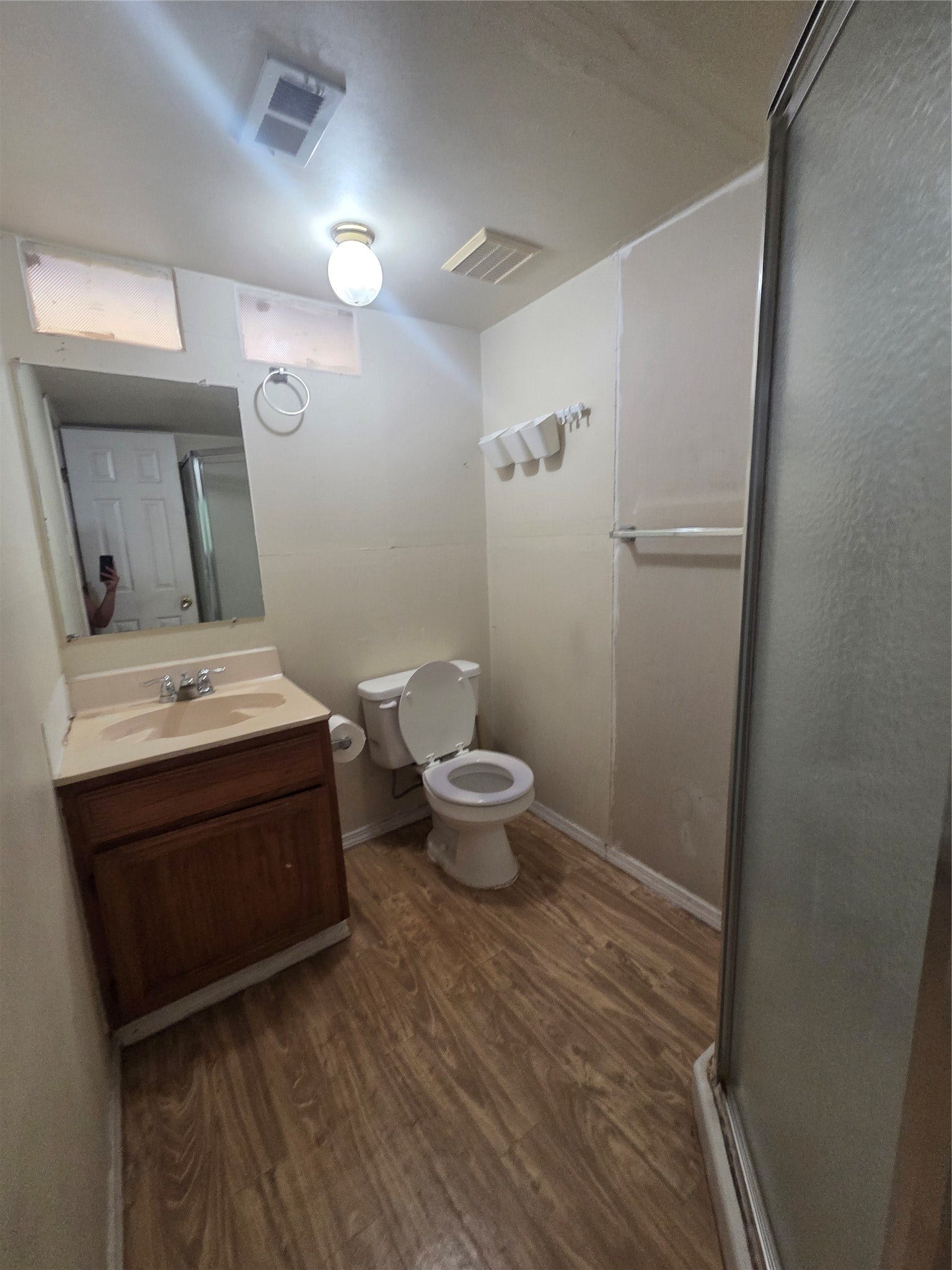 View of bathroom in studio apartment.