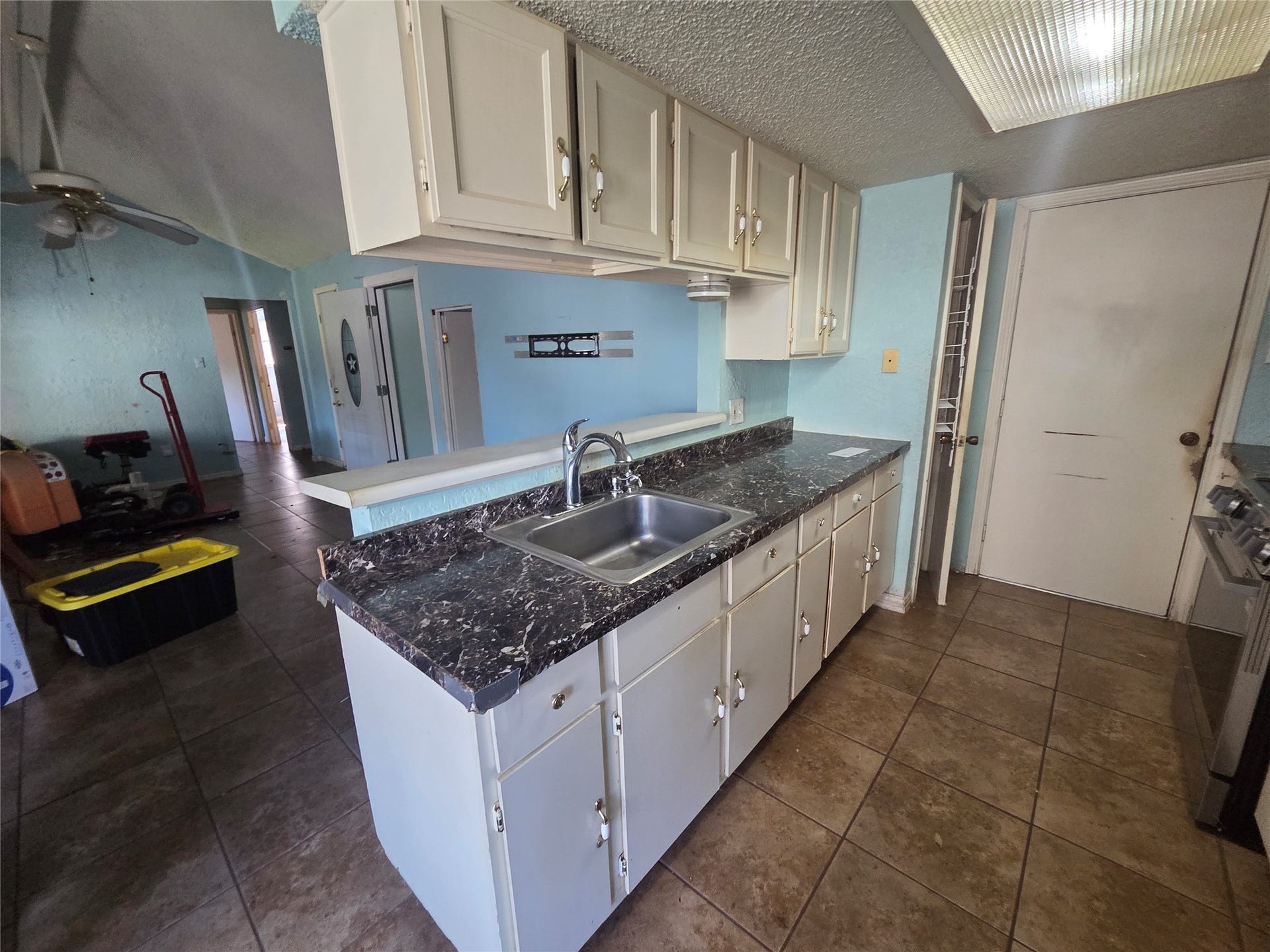 Kitchen cabinets with a view over looking the living room.