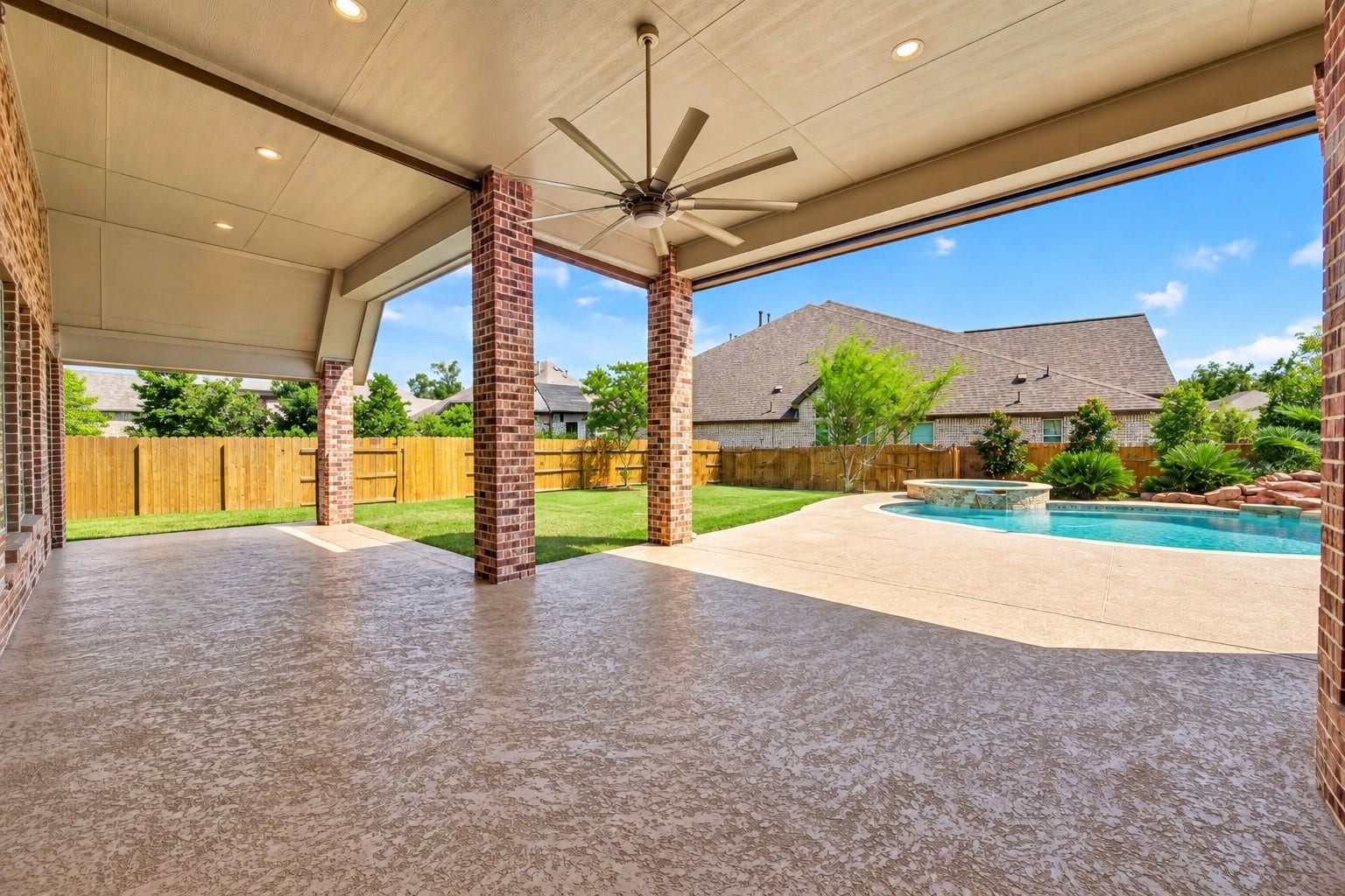 18902 Carson Glen Drive, New Caney, TX 77357 Backyard patio with aftey gate removed to show different perspective