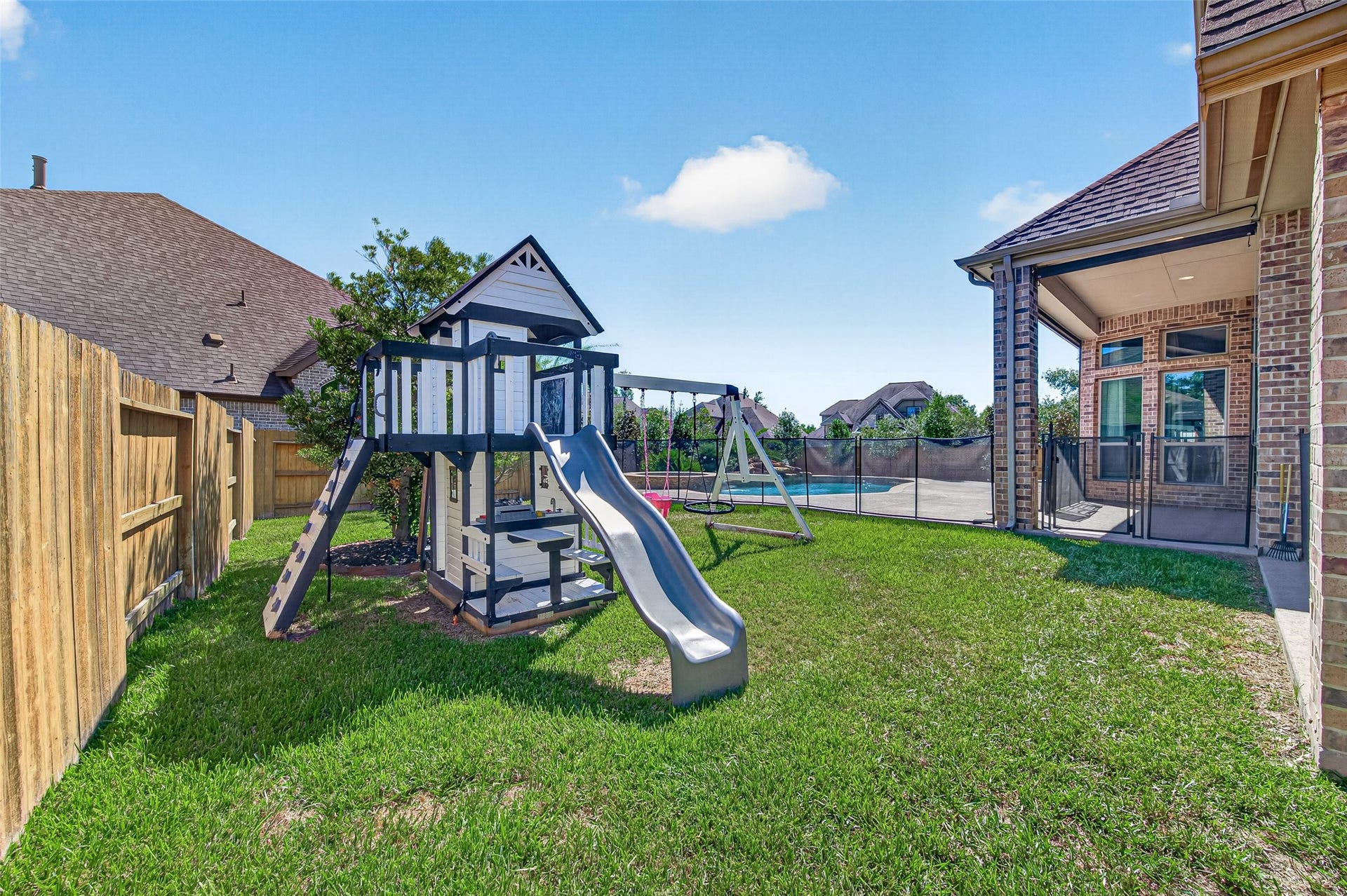 18902 Carson Glen Drive, New Caney, TX 77357 Backyard with playscape