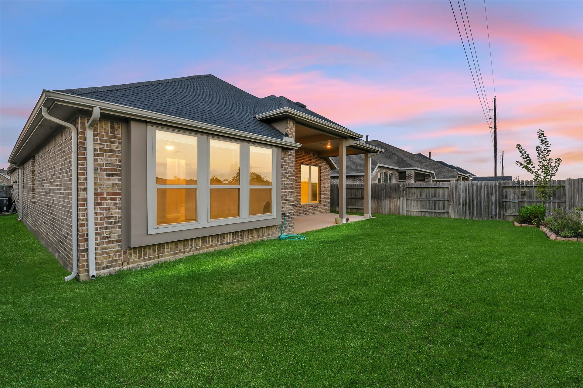 20330 Rose Gray Lane, Tomball, TX 77377 Established corner landscaping in the backyard adds to this home's beauty.