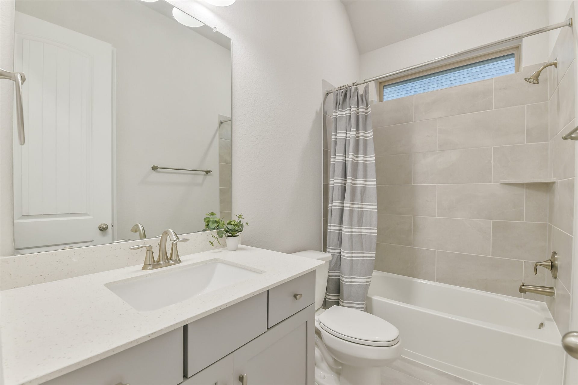 20330 Rose Gray Lane, Tomball, TX 77377 This bathroom features a shower and tub combo and a sink with plenty of counterspace.
