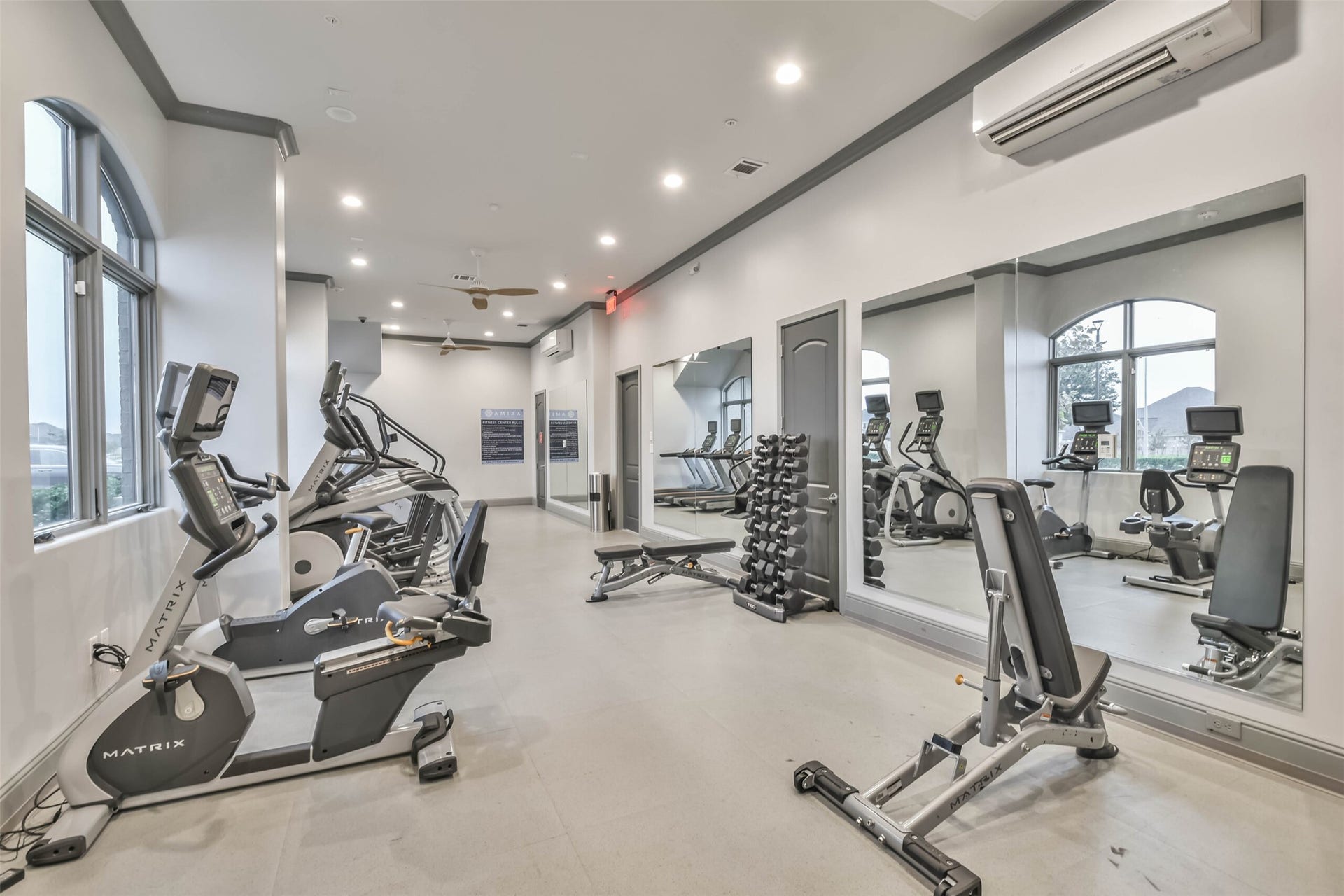 20330 Rose Gray Lane, Tomball, TX 77377 The fitness center includes a variety of workout machines.