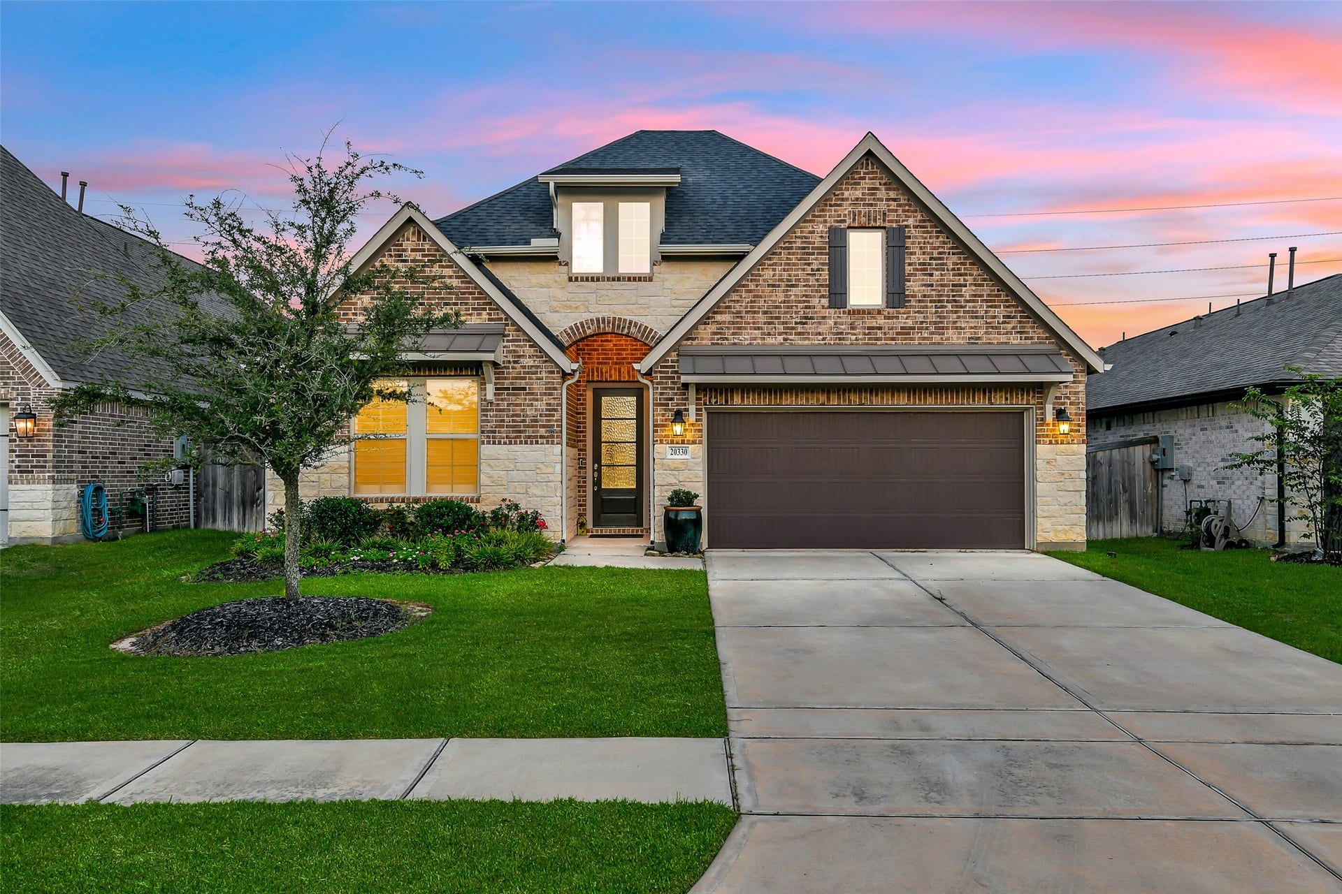 20330 Rose Gray Lane, Tomball, TX 77377 Mature landscaping in the front yard includes a beautiful full oak.