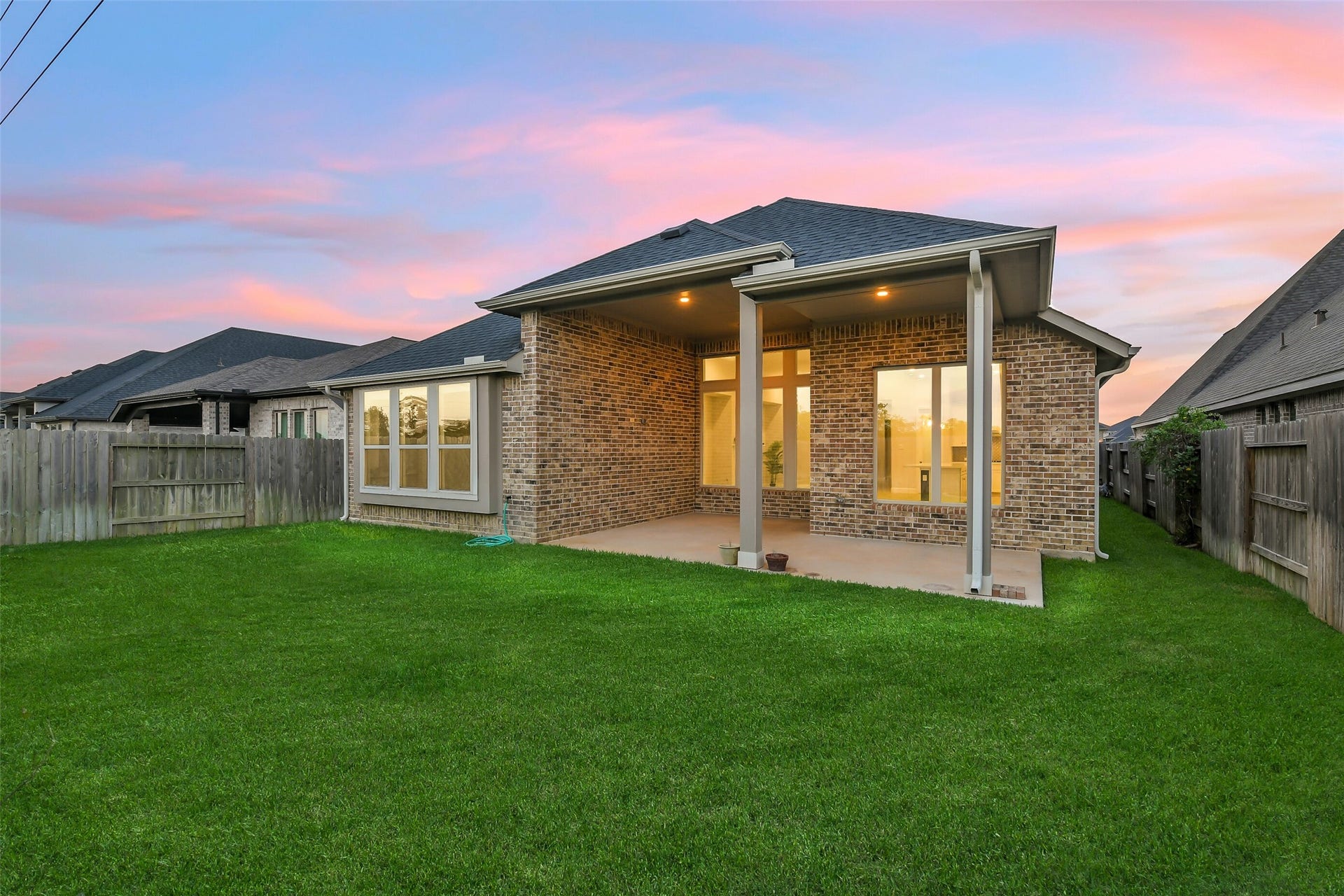 20330 Rose Gray Lane, Tomball, TX 77377 This large porch and backyard are perfect for entertaining.