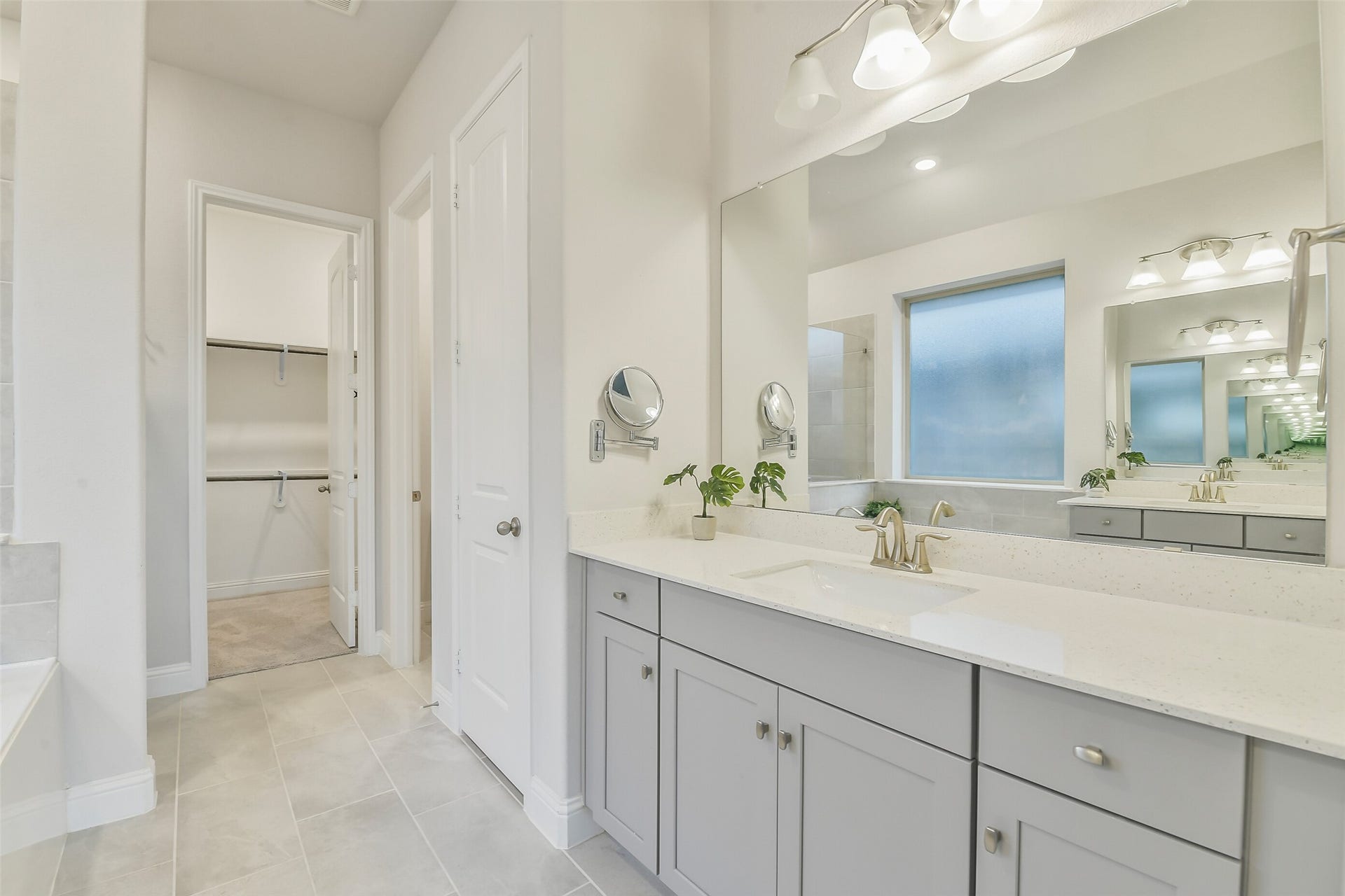 20330 Rose Gray Lane, Tomball, TX 77377 This primary bathroom features separate sinks with oversized countertops.