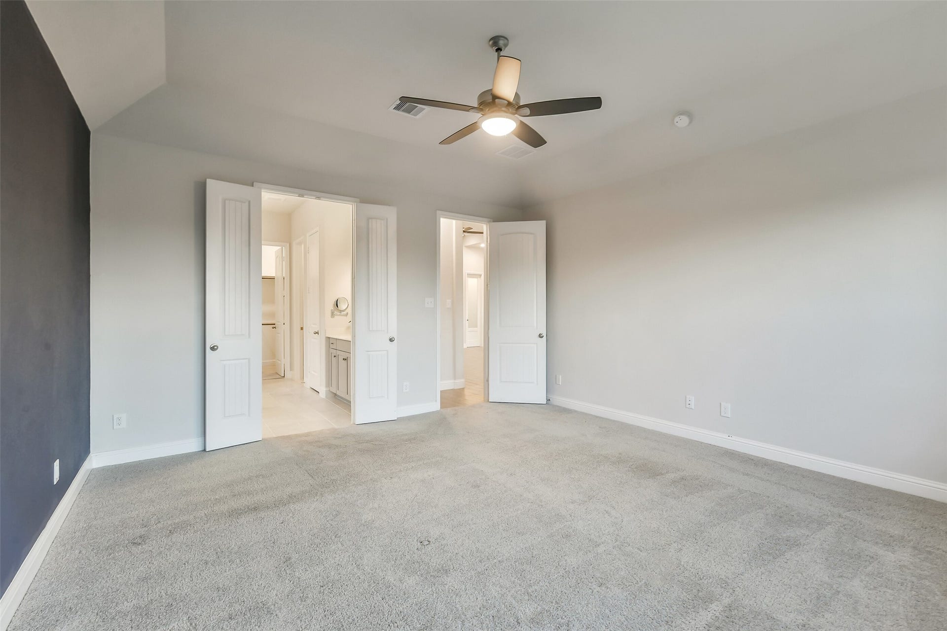 20330 Rose Gray Lane, Tomball, TX 77377 This generous primary bedroom opens to a large ensuite bath.