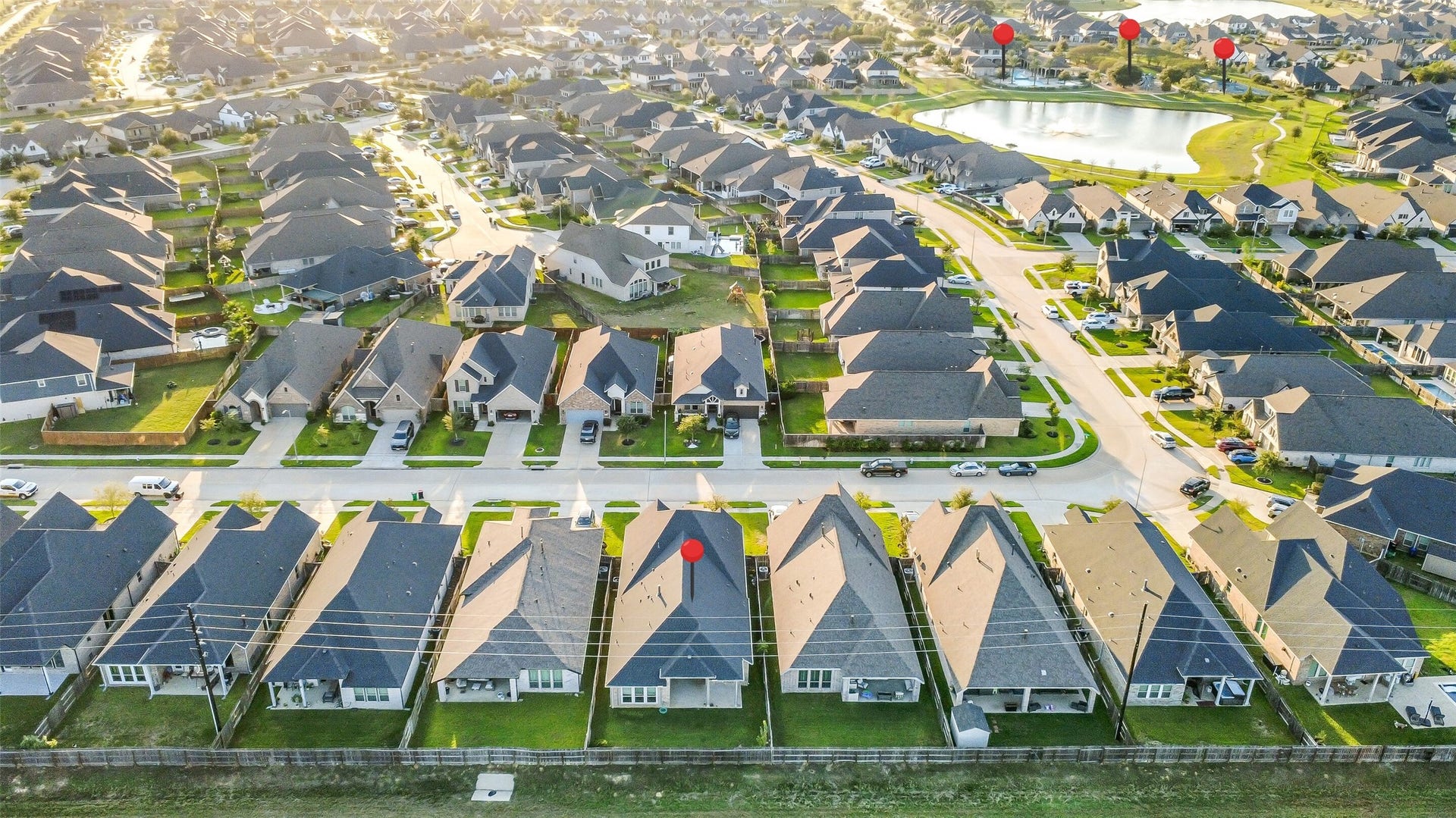 20330 Rose Gray Lane, Tomball, TX 77377 View of the home in relation to the Amira Resort, pool, playground, pond, and pickleball courts. These amenities are conveniently located near the home!