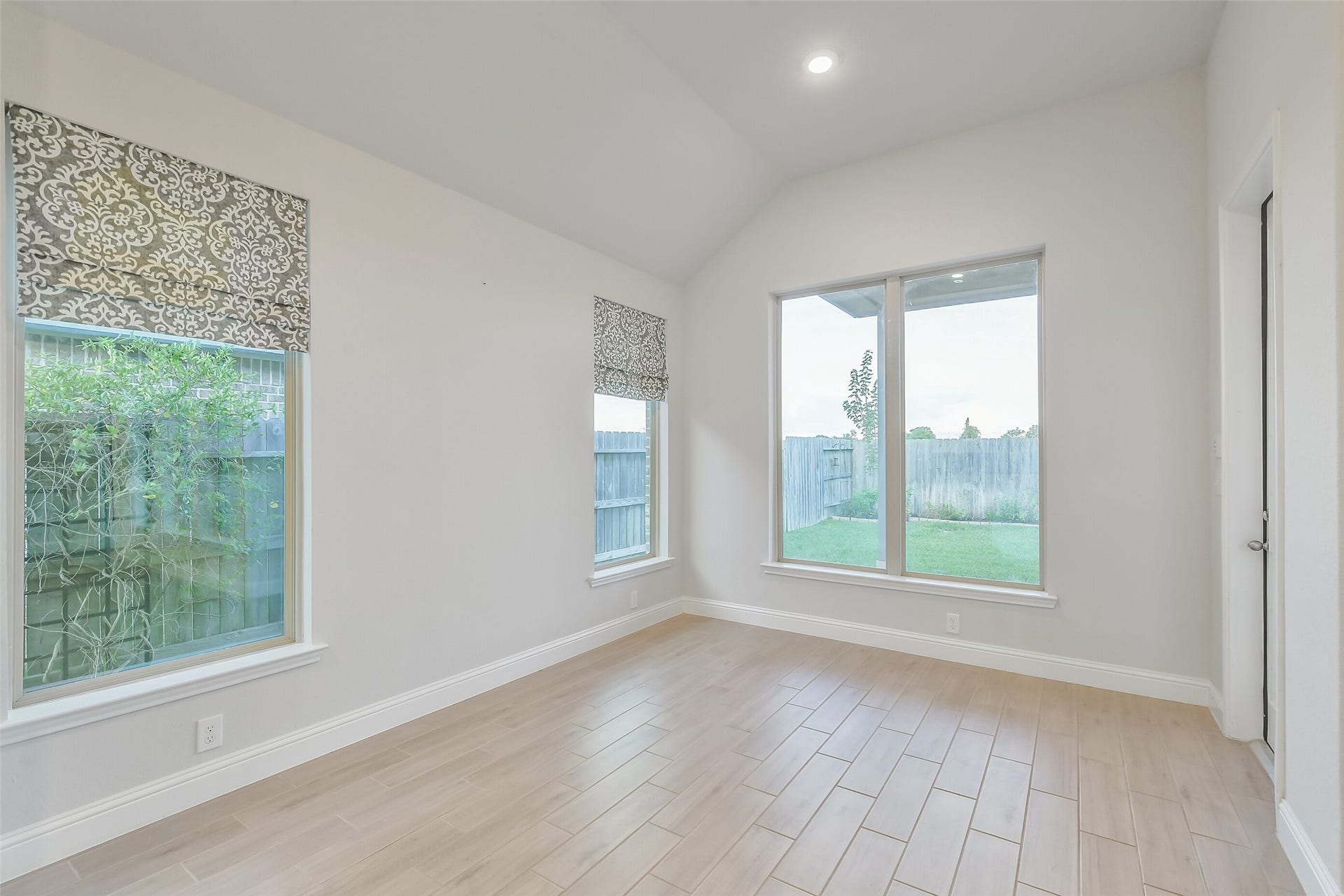 20330 Rose Gray Lane, Tomball, TX 77377 Natural light from the windows brighten this dining area.