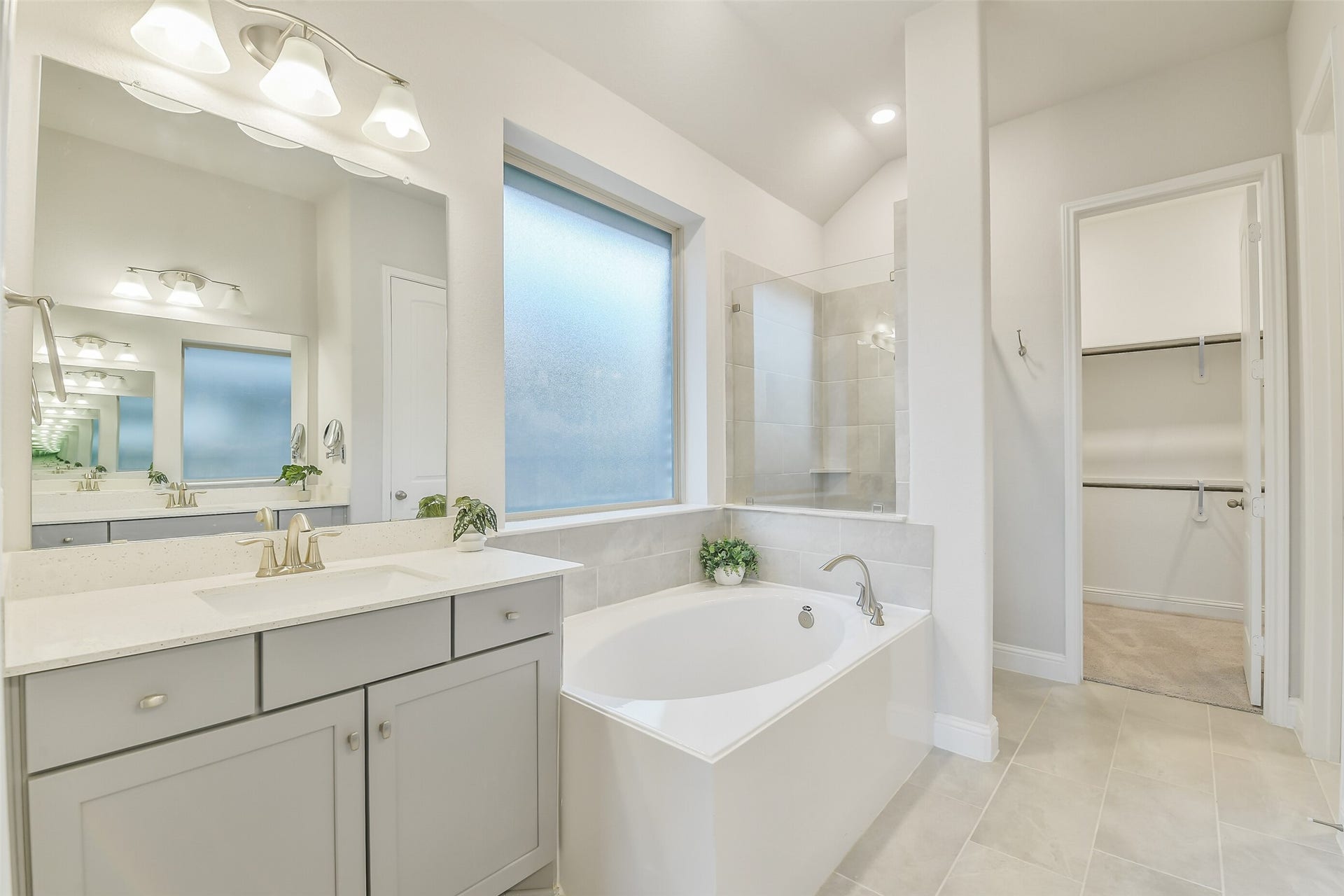 20330 Rose Gray Lane, Tomball, TX 77377 This large frosted window provides natural light in the primary bathroom.