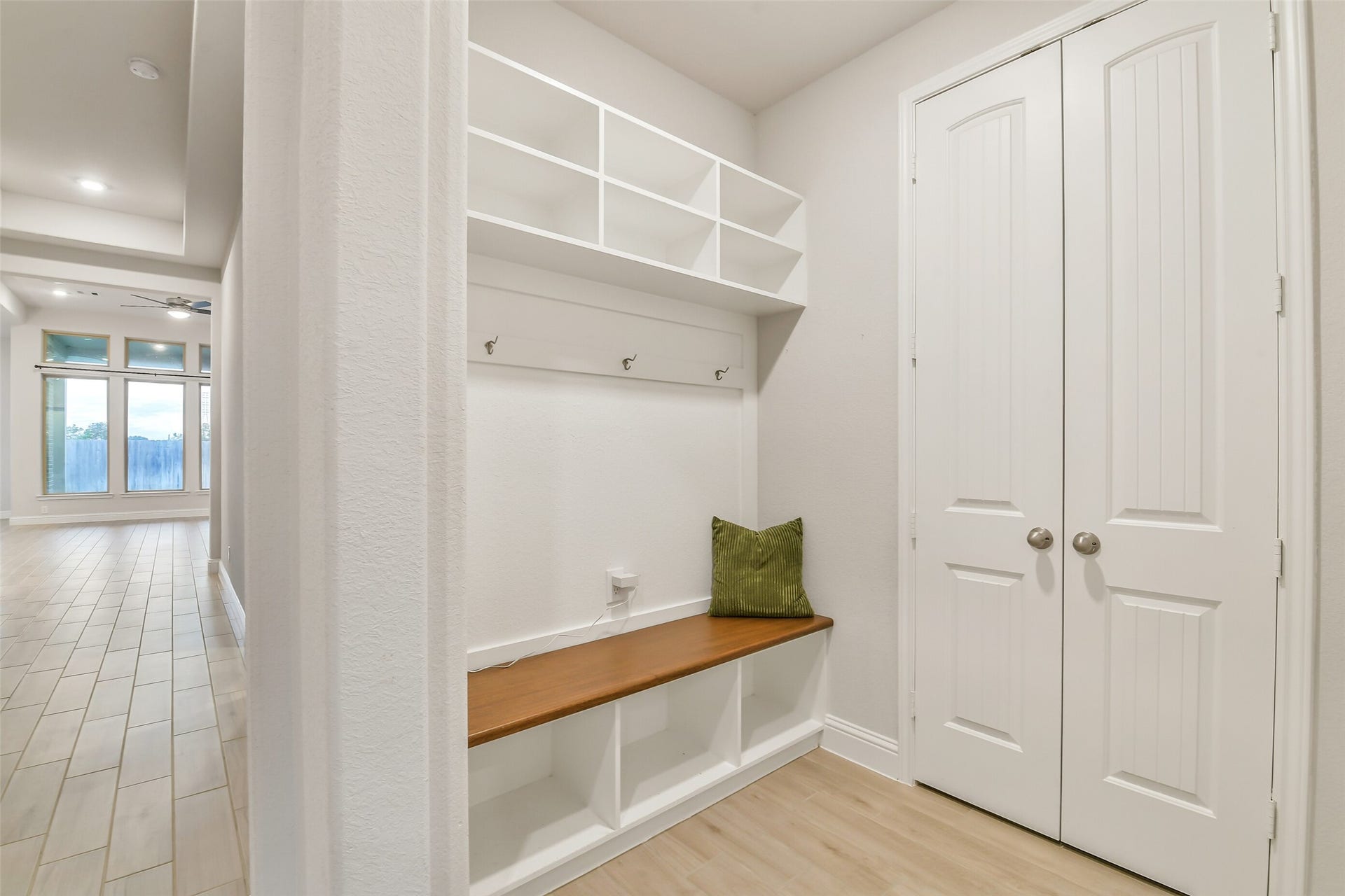 20330 Rose Gray Lane, Tomball, TX 77377 The mudroom with custom wood bench is conveniently located directly off the garage.