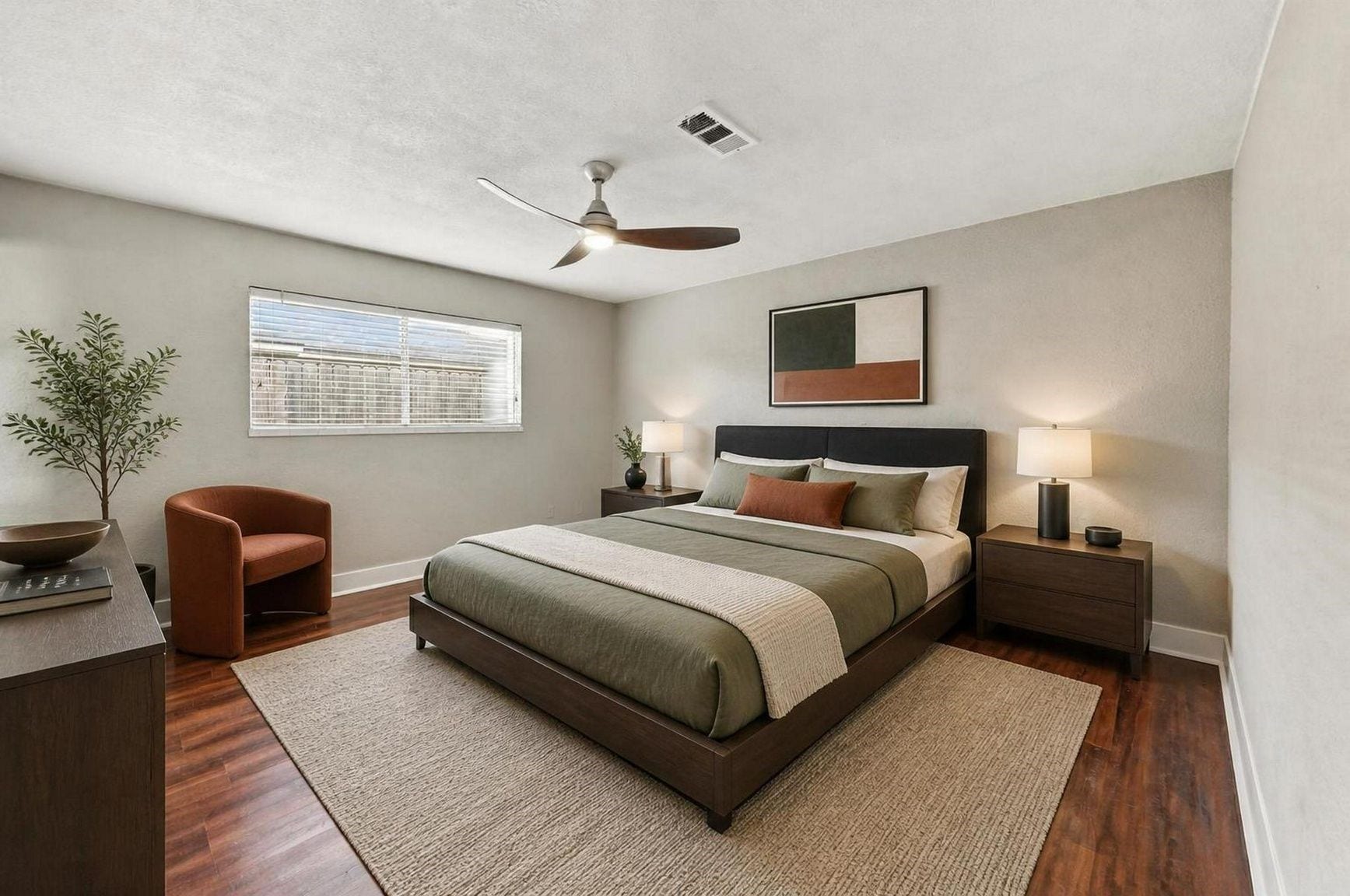 1023 Twinbrooke Drive, Houston, TX 77088 This bedroom is styled with a warm, quiet feel and a finished retreat-style setup. Virtually staged.