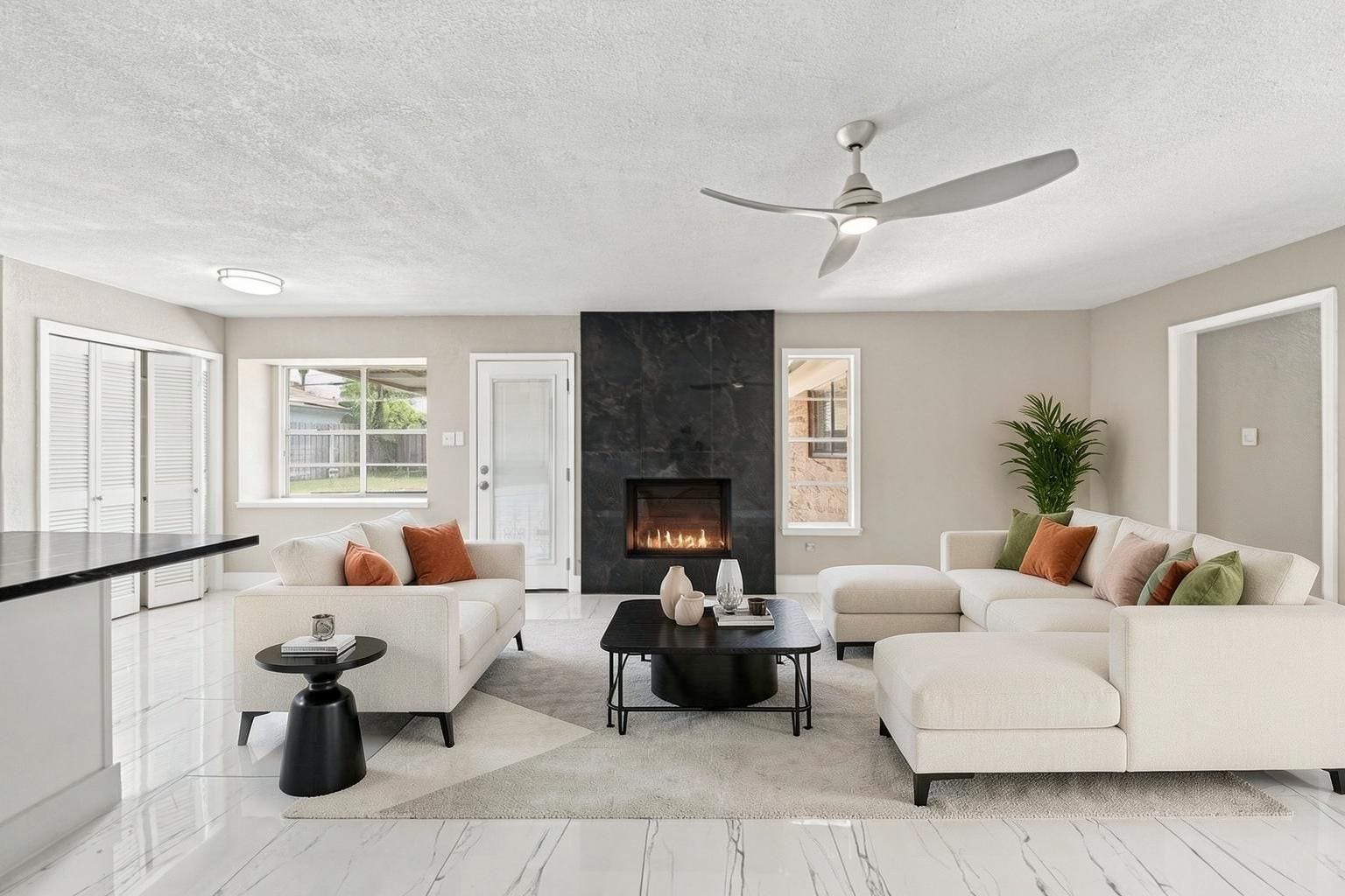 1023 Twinbrooke Drive, Houston, TX 77088 The fireplace anchors the room with a warm focal point and clean modern contrast. Virtually staged.