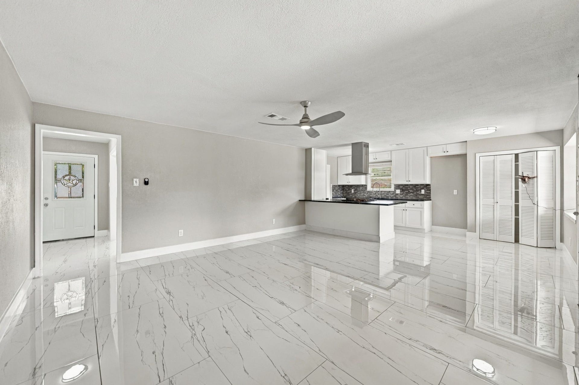 1023 Twinbrooke Drive, Houston, TX 77088 The open layout brings the kitchen, living, and dining spaces together with a bright, seamless flow. Virtually staged.
