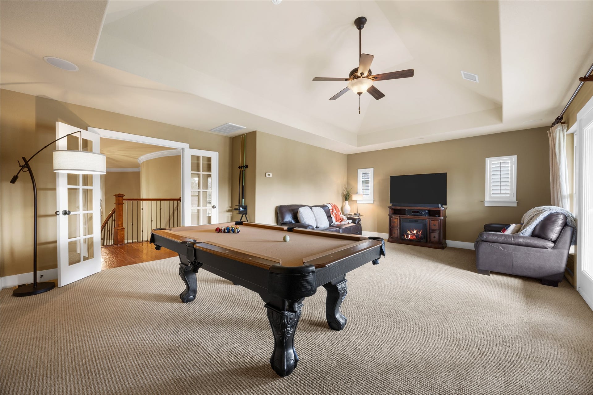 18515 Duke Lake Drive, Spring, TX 77388 Entertainment central! This oversized upstairs game room offers plenty of space for a pool table, comfortable seating, and movie nights. French doors provide an elegant entrance.