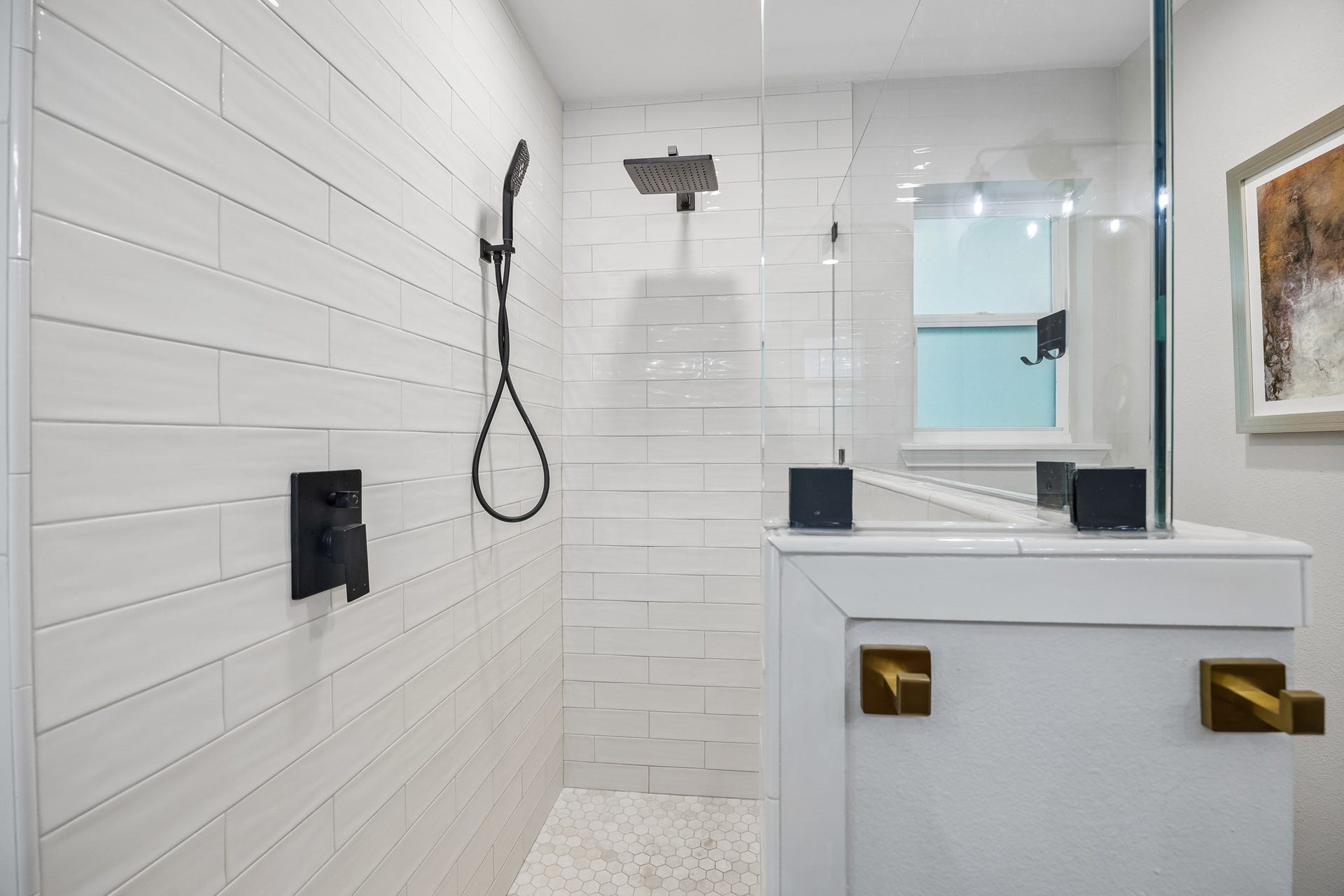 12314 Honeywood Trail, Houston, TX 77077 Walk-in shower is equipped with both a rainfall showerhead and a handheld sprayer.
