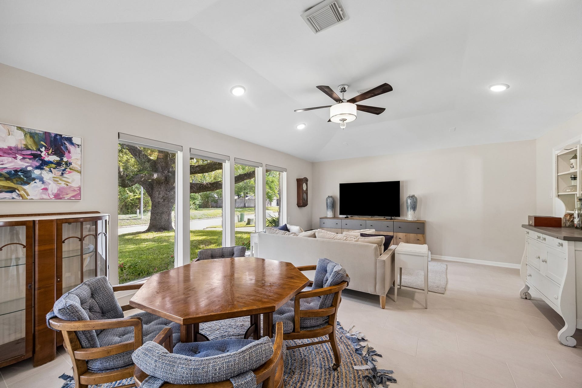 12314 Honeywood Trail, Houston, TX 77077 Originally designed as formal living and dining rooms, this spacious area is currently used as a game room and den. A high ceiling and large windows showcase the beautiful oak tree views, while the open layout offers flexibility for entertaining.