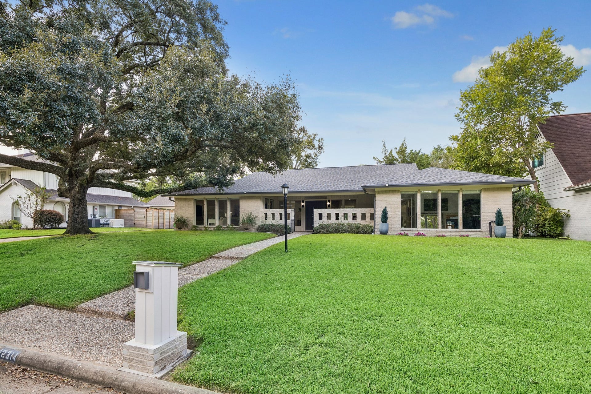 12314 Honeywood Trail, Houston, TX 77077 This one story home sits on a 16,863 sf lot with this stately oak tree on the front lawn. In 2022 a new roof, gutters, HVAC, and ductwork were installed.