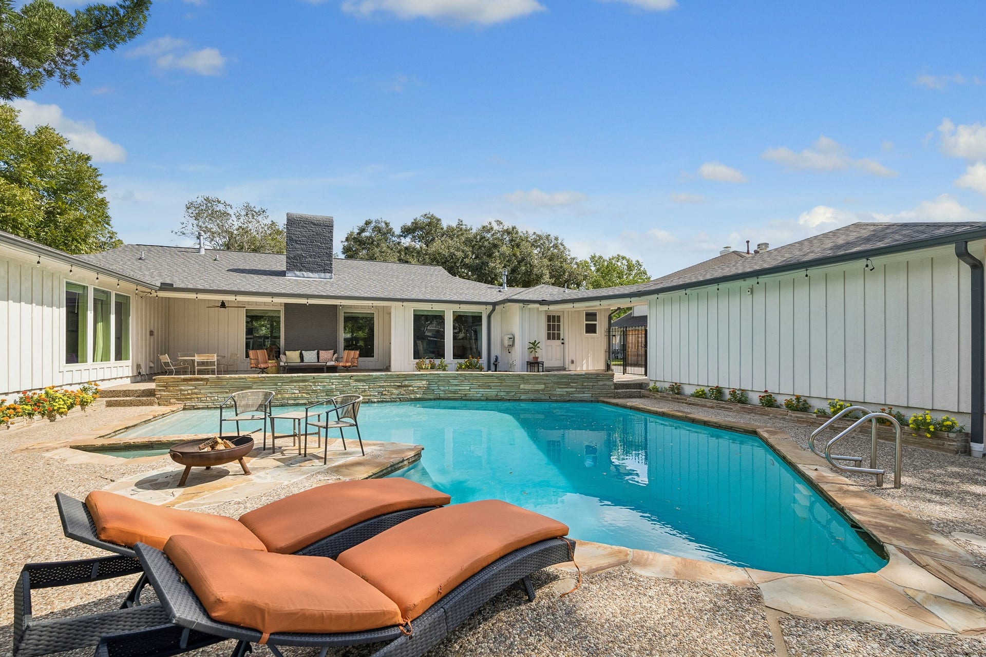 12314 Honeywood Trail, Houston, TX 77077 The stacked stone continues to the backyard surrounding the expansive pool and the planters on either side. The pool was replastered in 2022.