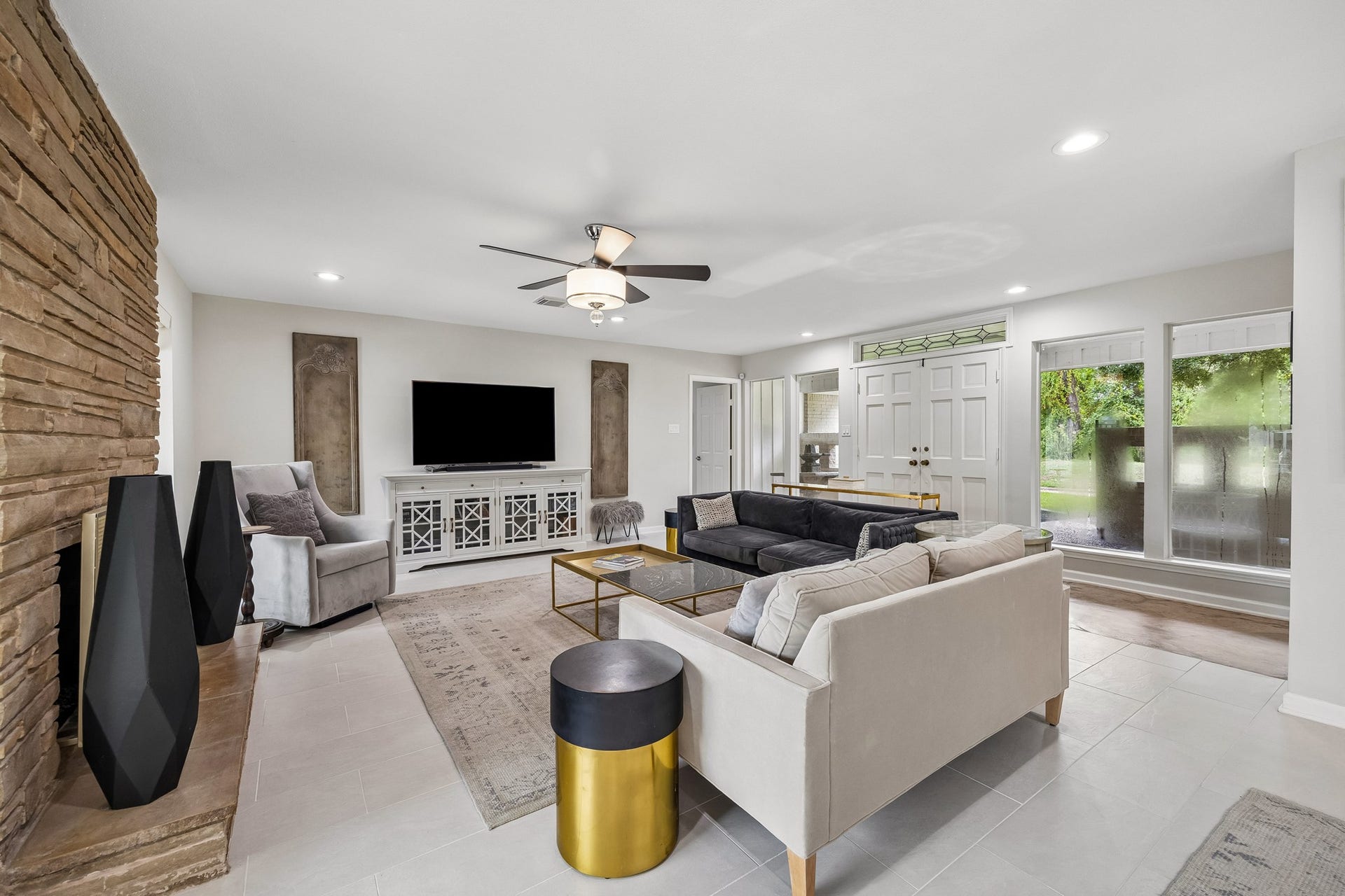 12314 Honeywood Trail, Houston, TX 77077 This view shows the living room's generous proportion, with floor to ceiling windows overlooking the front patio.