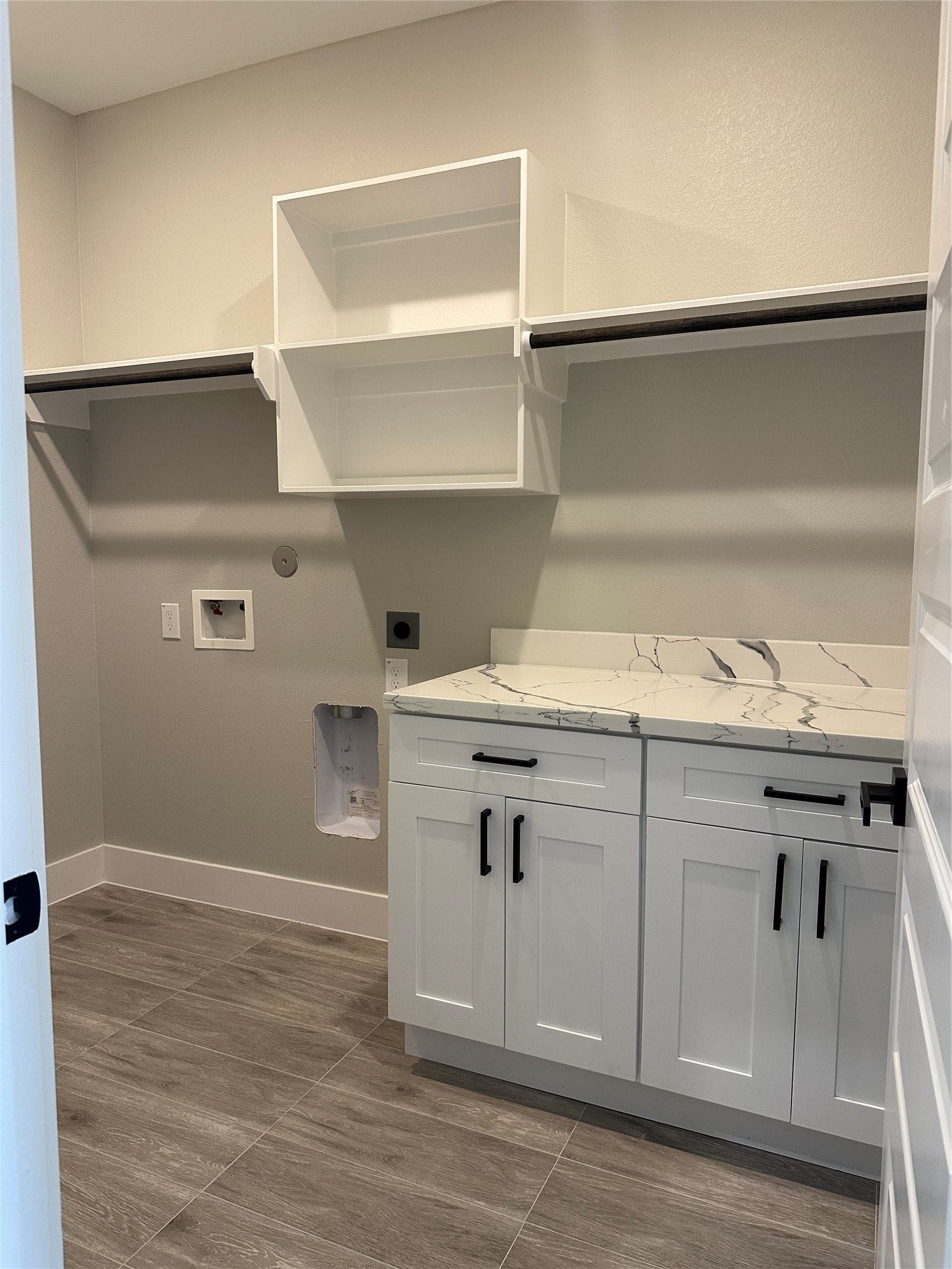 630 Ezekiel Smith Street, Prairie View, TX 77484 Utility room with quartz counter-top