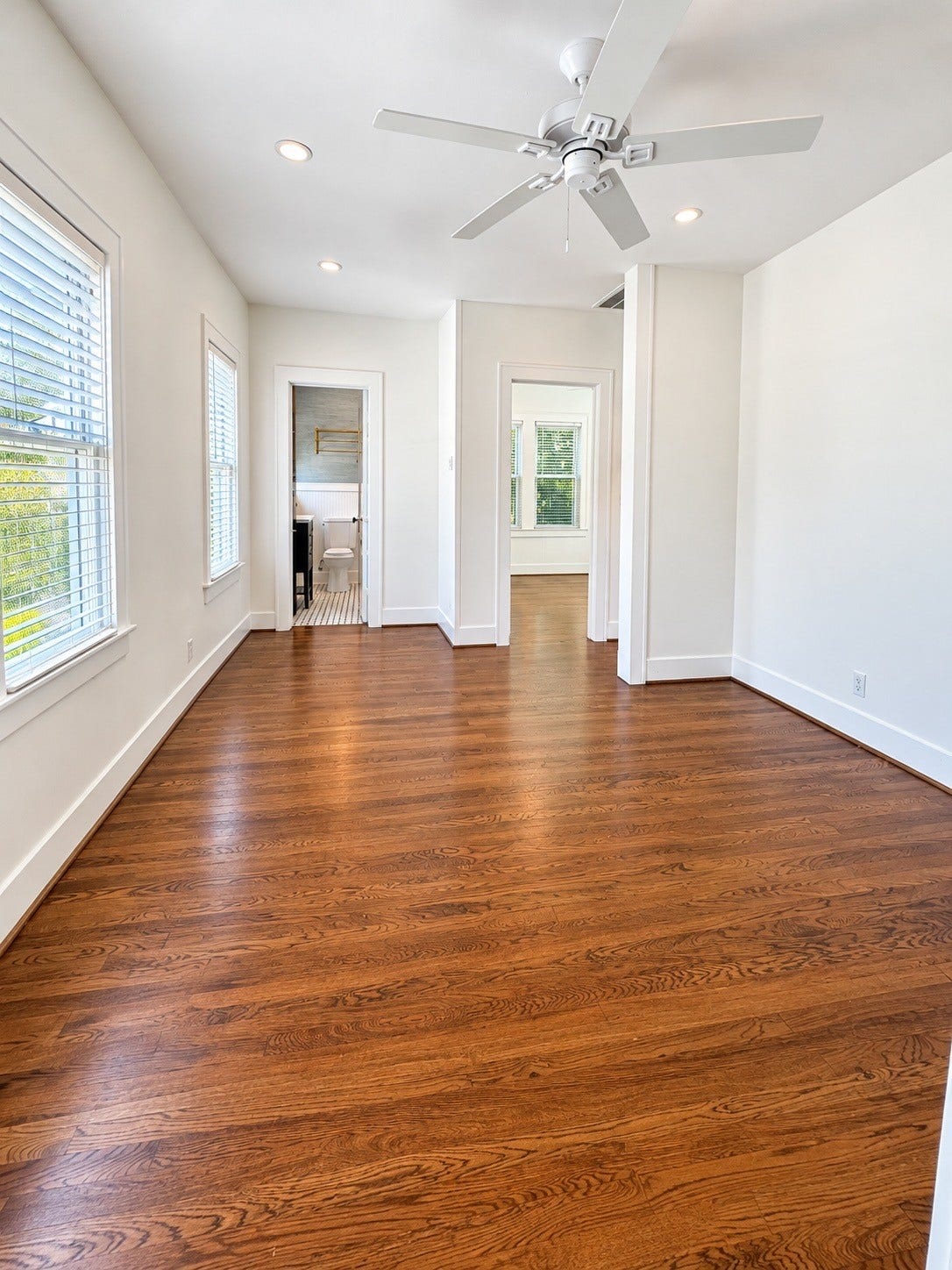 914.5 W Melwood Street, Houston, TX 77009 The spacious living room, shown without furniture, offers a blank canvas to create your perfect space.