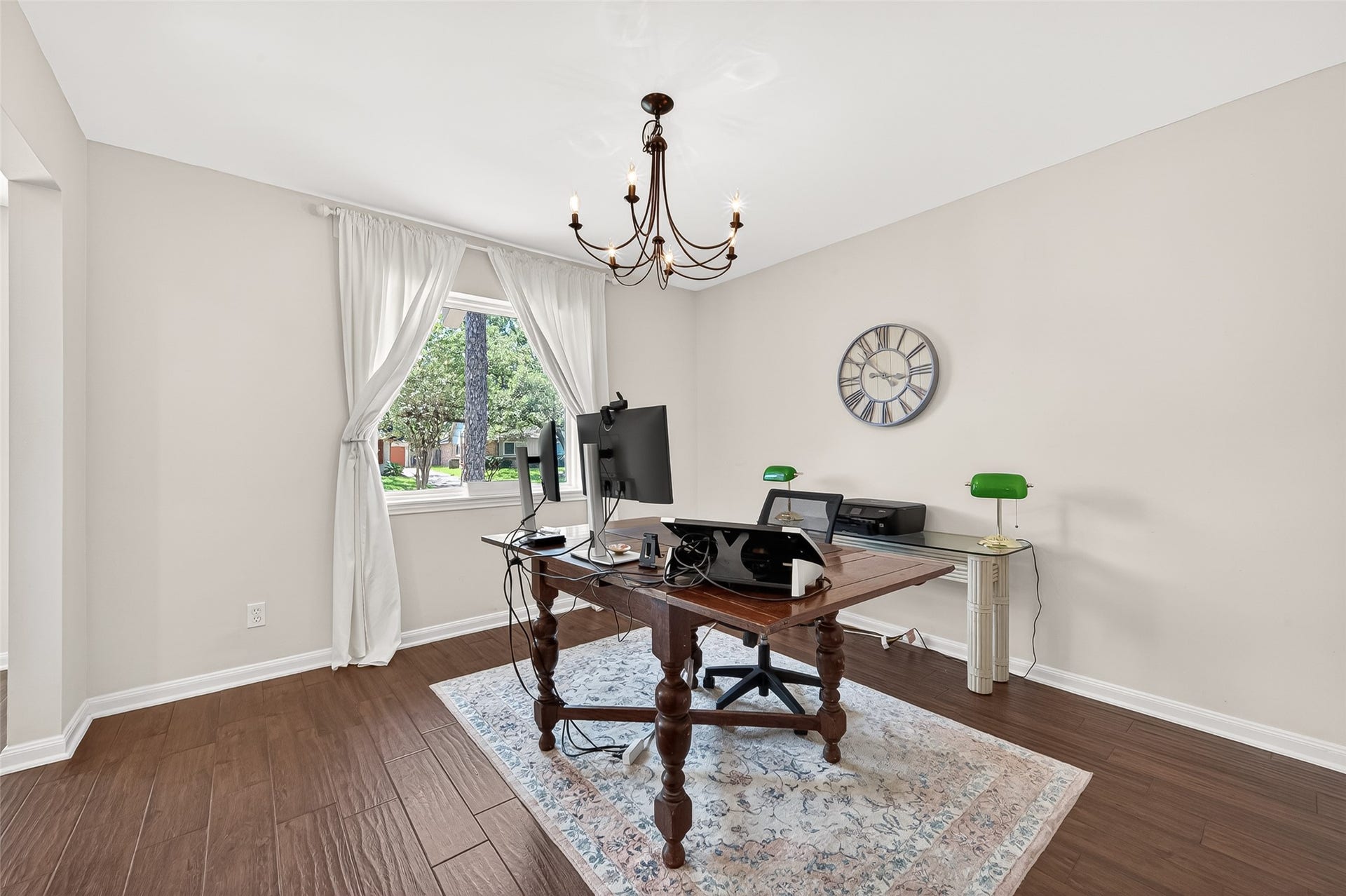 2610 Teague Road, Houston, TX 77080 This room is currently being used as an office but is a great flex space for a playroom or even to relocate the dining room. Large window and classic chandelier.