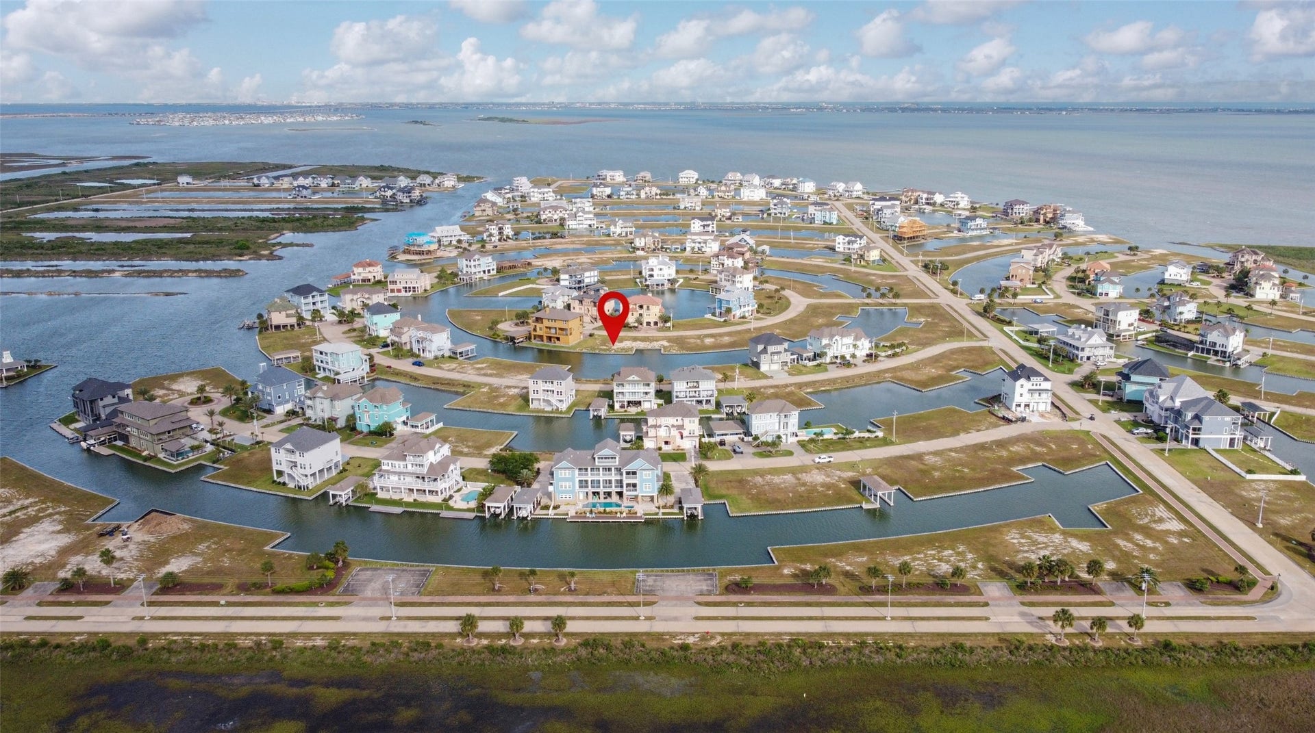 7 Big Torch, Hitchcock, TX 77563 From the neighborhood entrance looking toward West Bay and the Intracoastal Waterway, the pin highlights the prime location of this waterfront lot within Harborwalk.